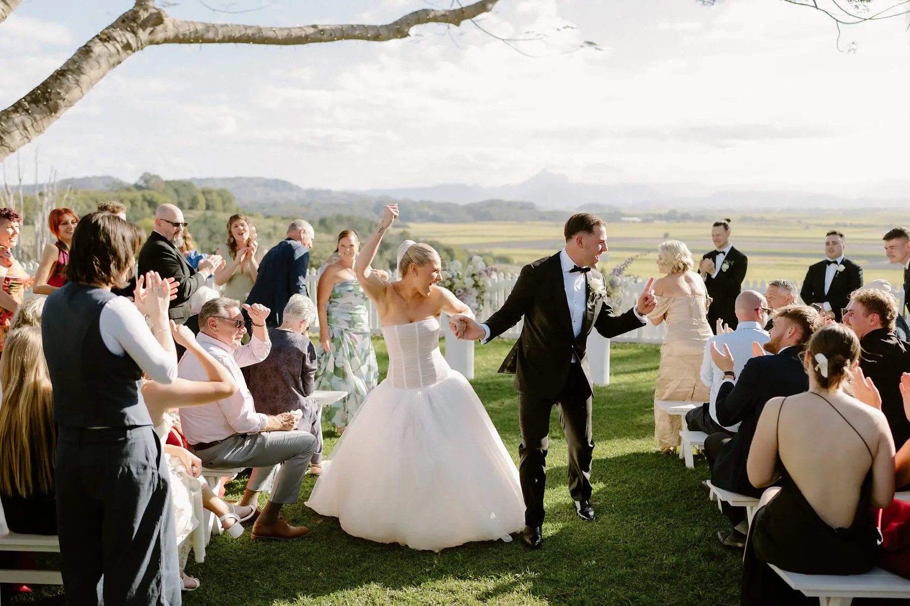 Walking back up the aisle under the tree to applause, Botanica Plantation House