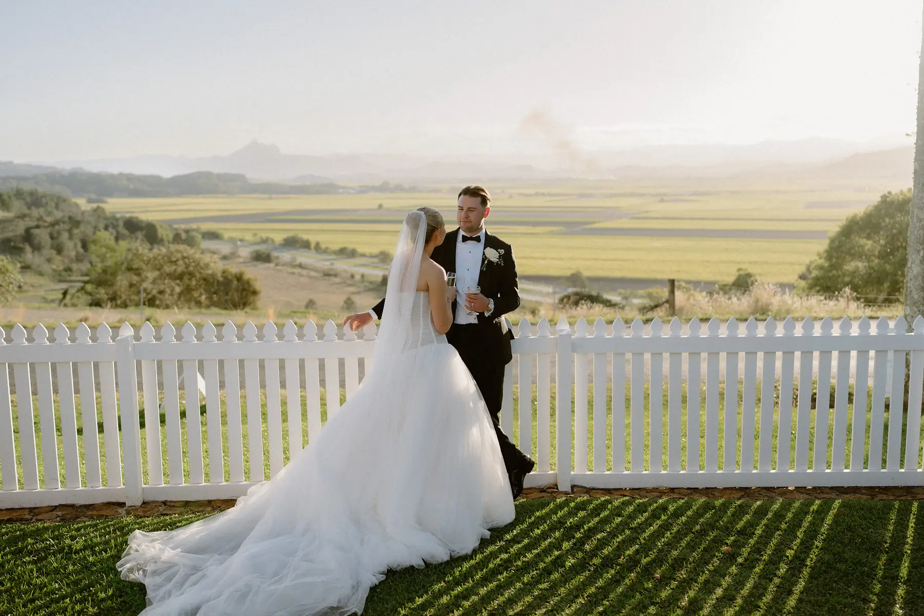 At the fence line as the light turns gold over the cane fields, Botanica Plantation House