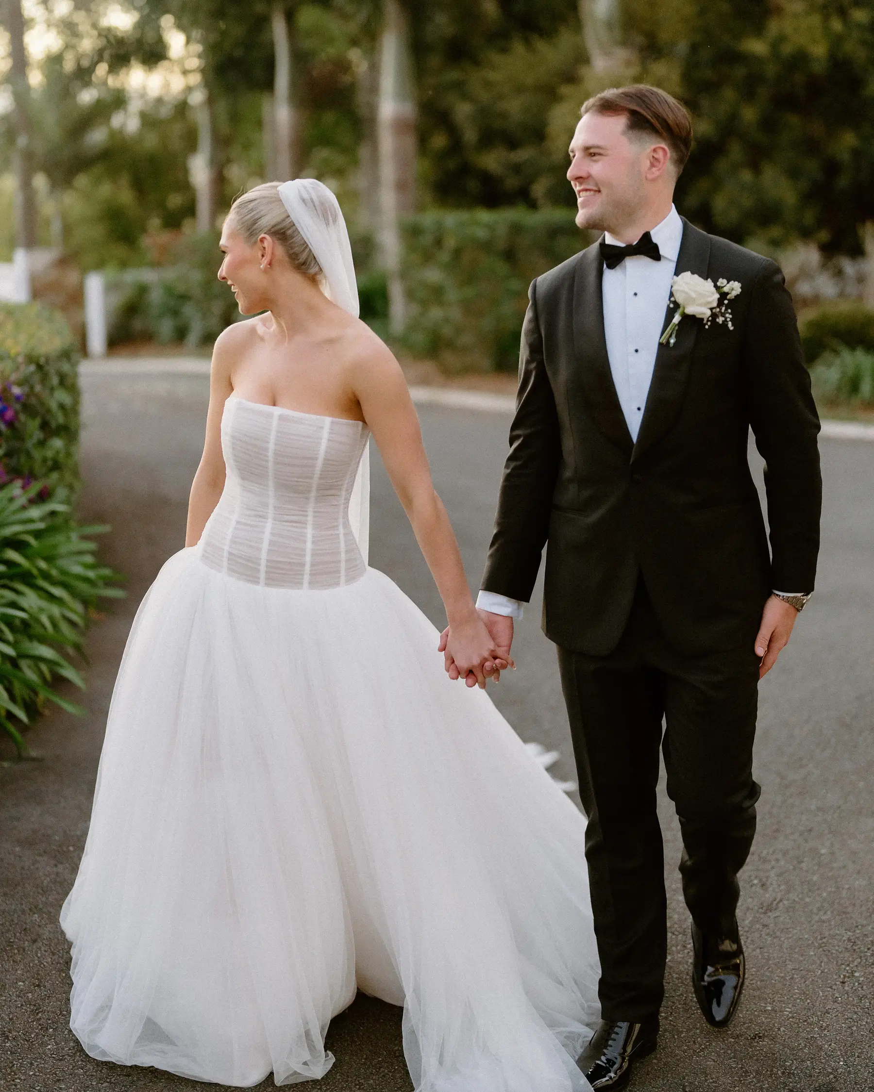 Hand in hand on the garden path to the reception, Botanica Plantation House