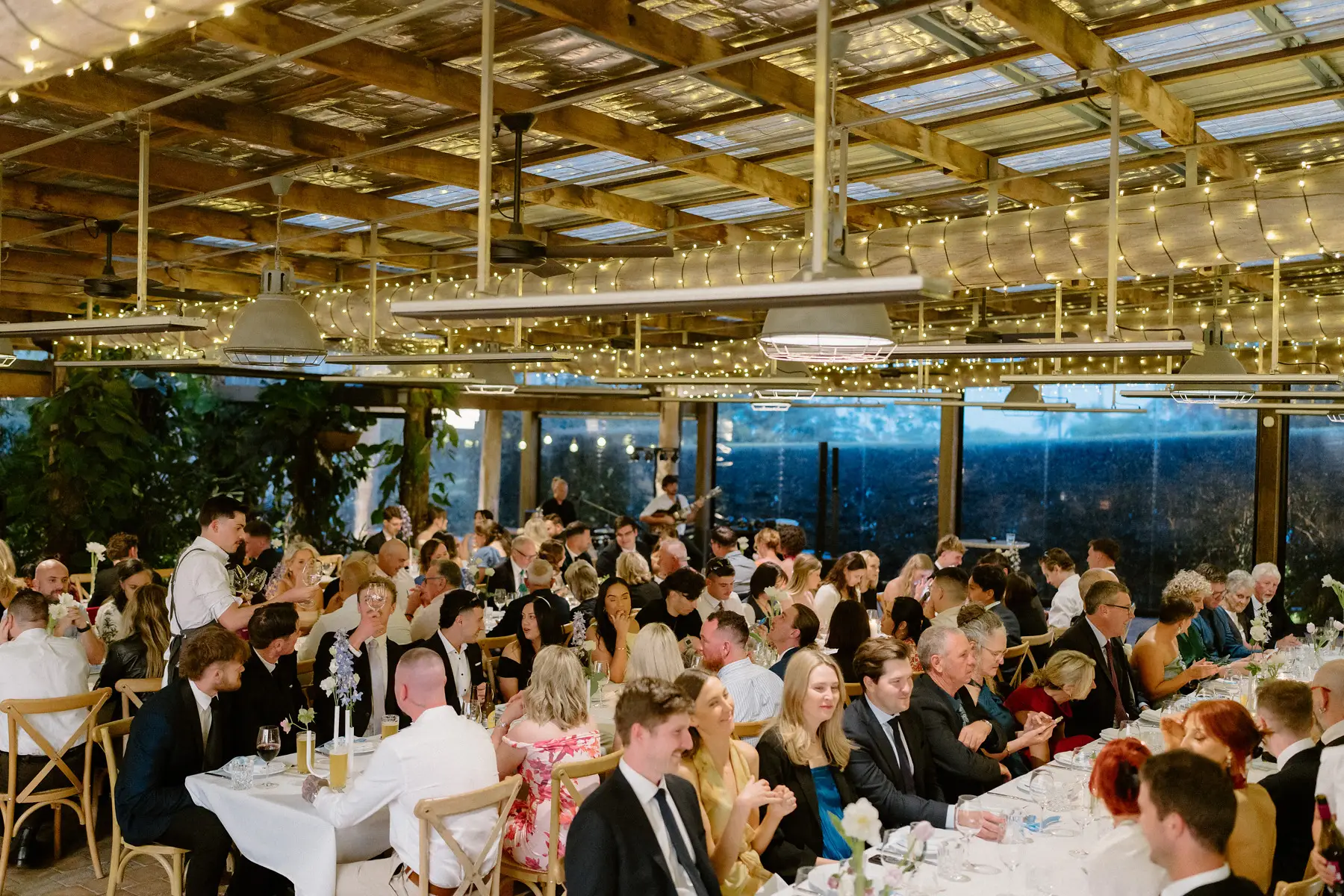The reception room full under fairy lights, Botanica Plantation House