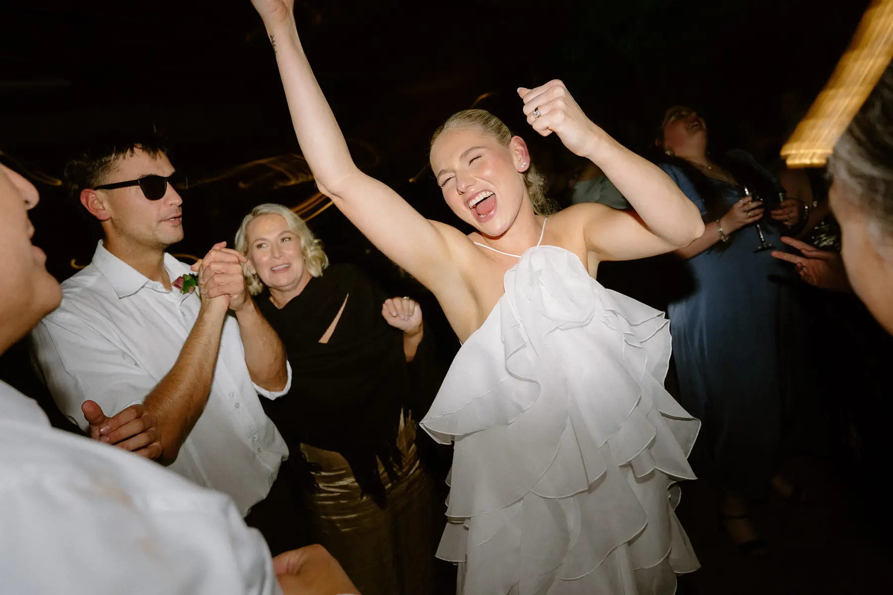 Georgia mid-song with her arms in the air, Botanica Plantation House
