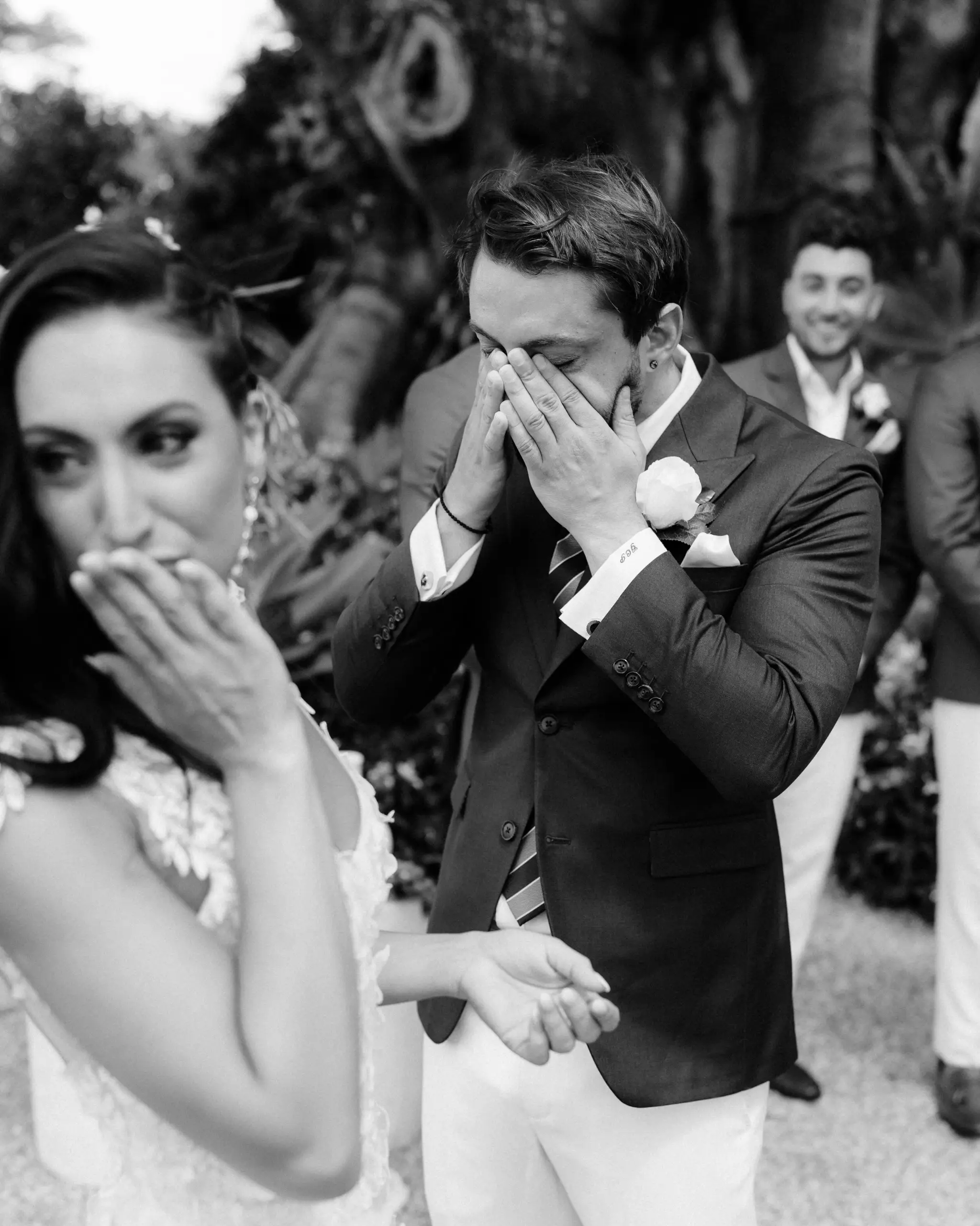 Guests wiping away tears during the vows