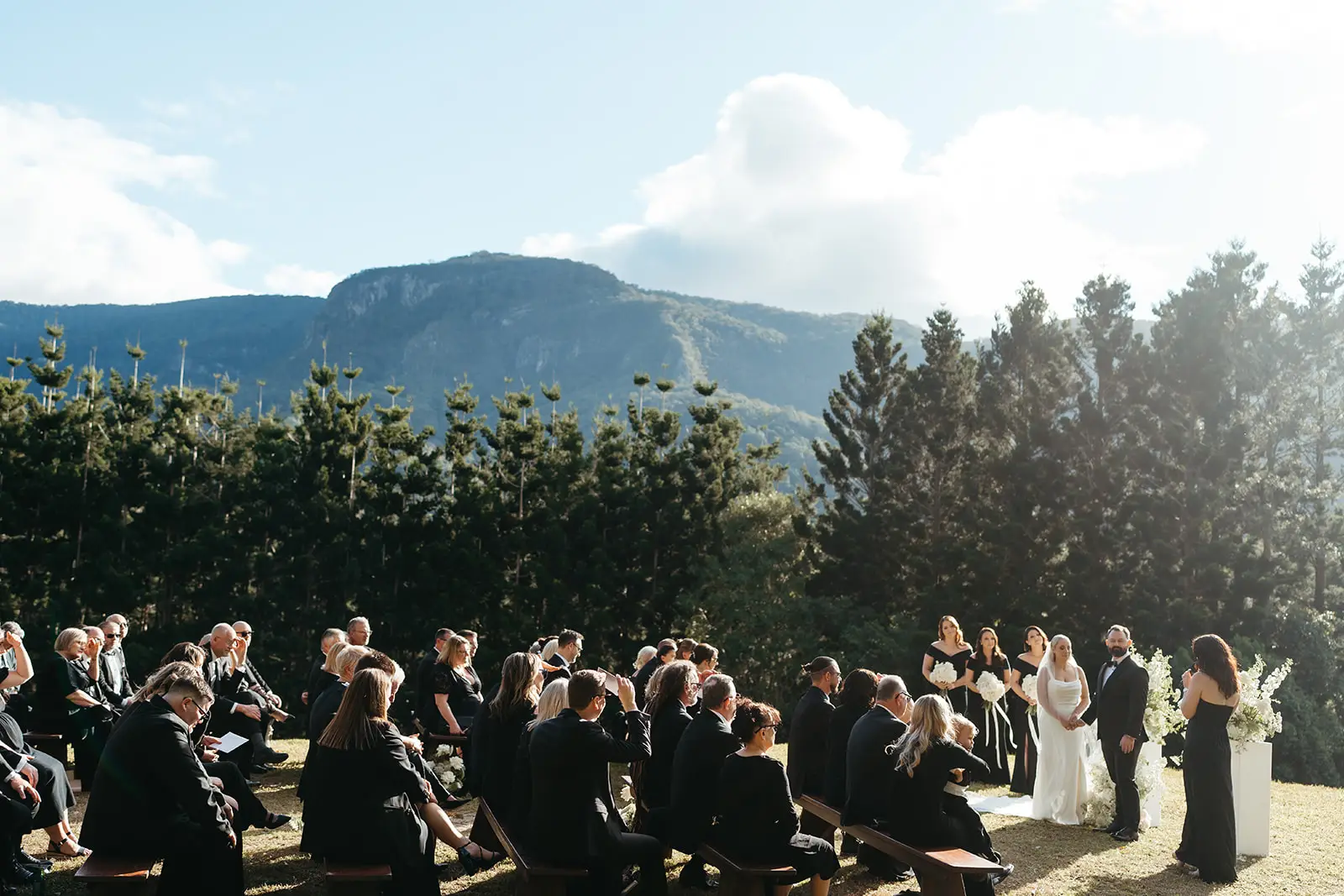 The seated guests against the mountain wall, The Bower Estate