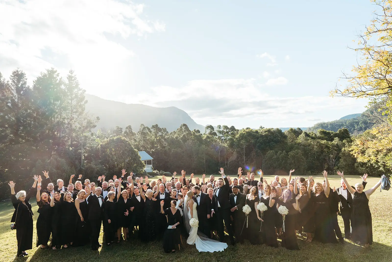 The whole guest list on the lawn in the late sun, The Bower Estate