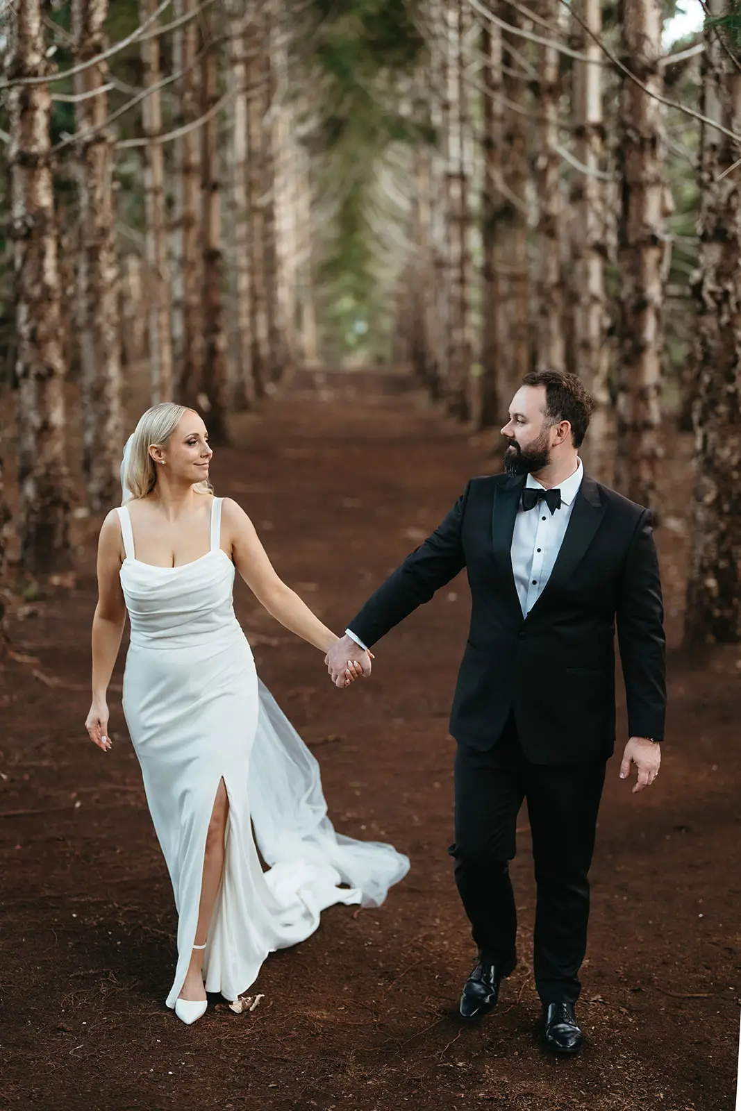The couple walking the pine forest path, The Bower Estate