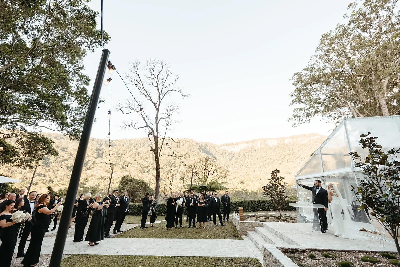 Guests outside the marquee with the hinterland behind, The Bower Estate