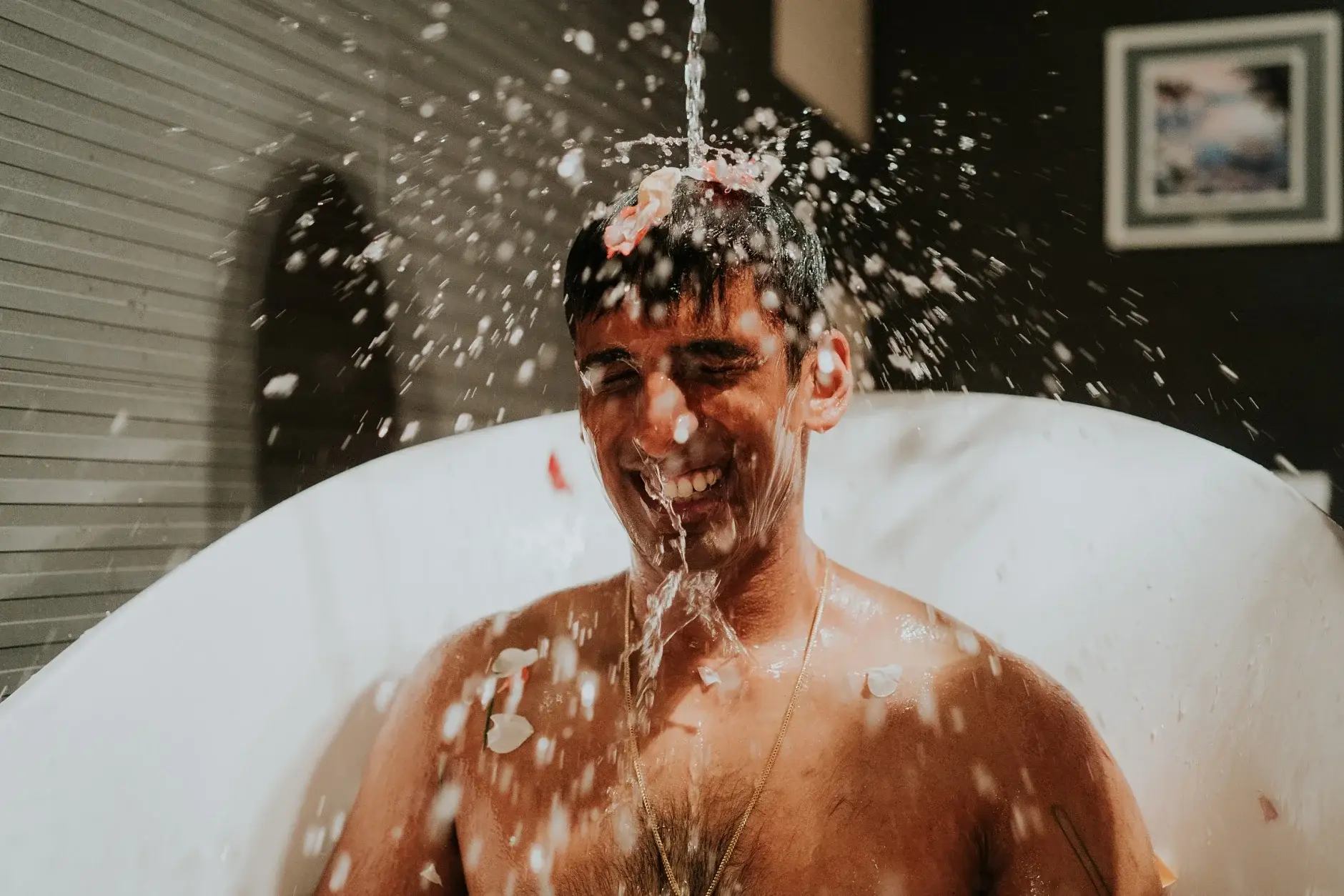 Brahman laughing as water is poured over his head, Sydney