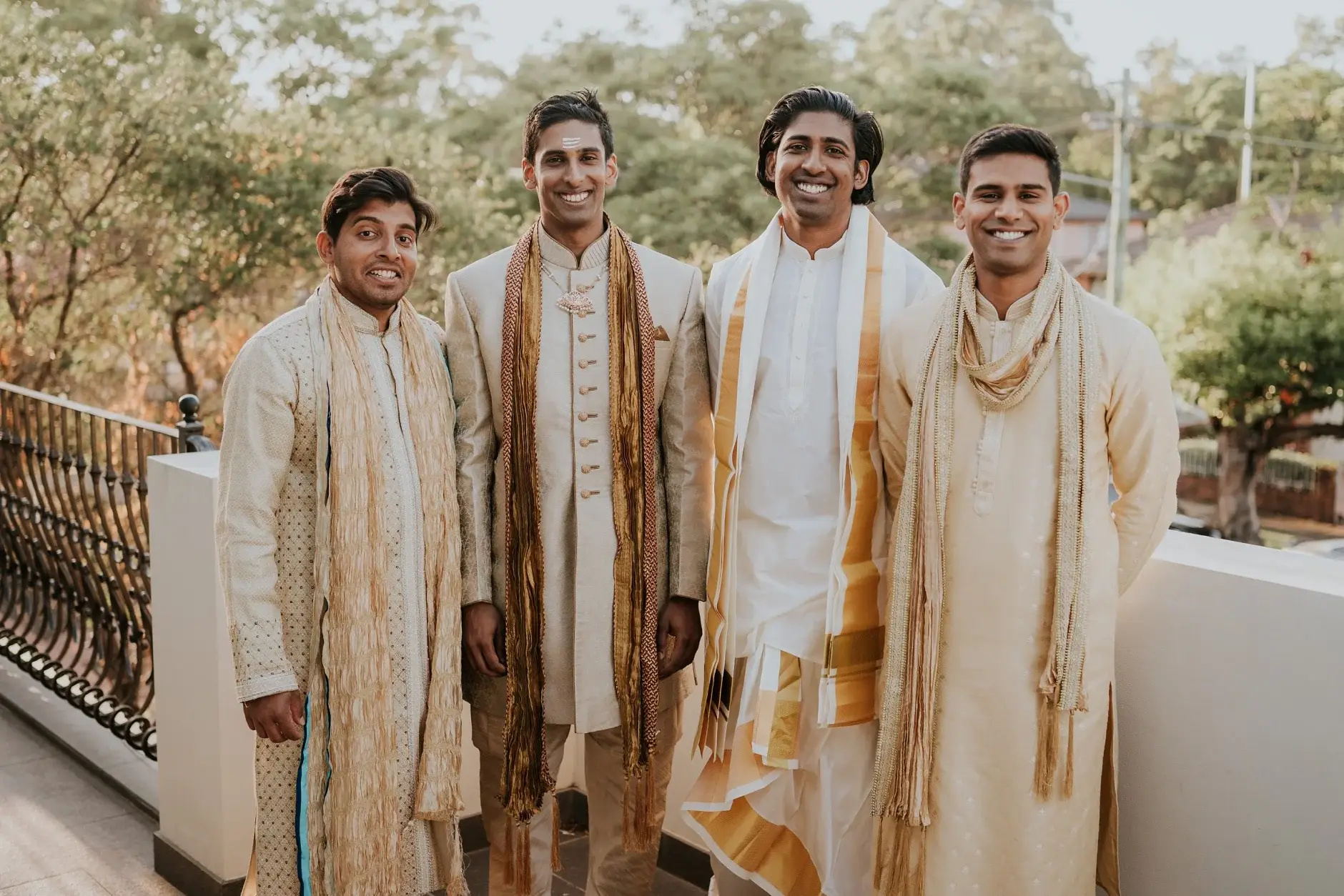 Brahman with his groomsmen in matching sherwanis on the balcony