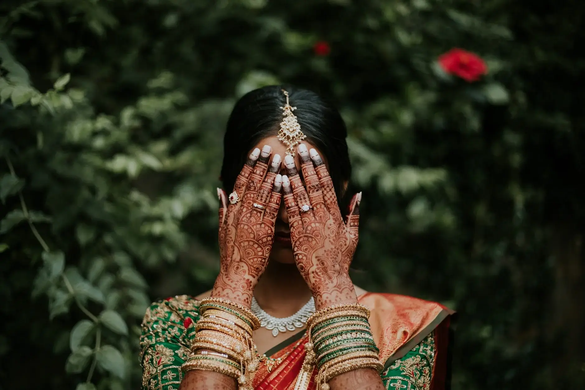 Priyanka covering her face with her hennaed hands, Sydney