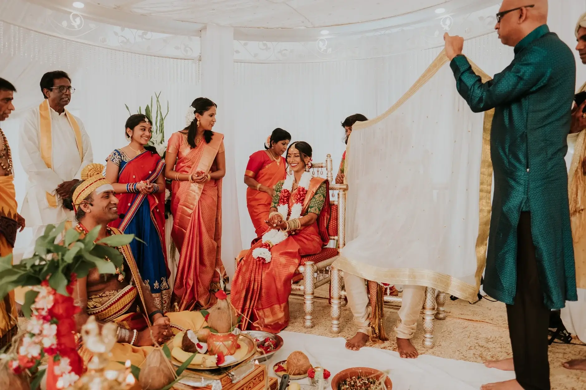 The priest holding the cloth screen at the mandapam, Sydney