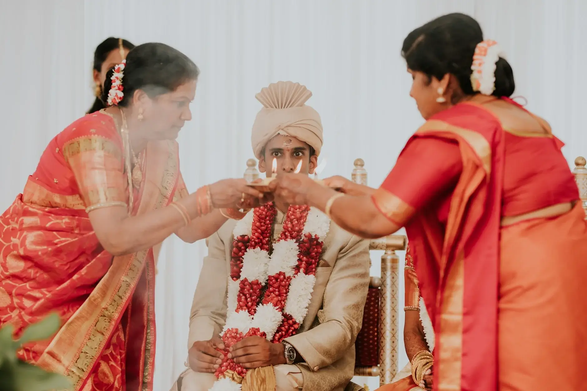 Family feeding Brahman during the rituals, Sydney