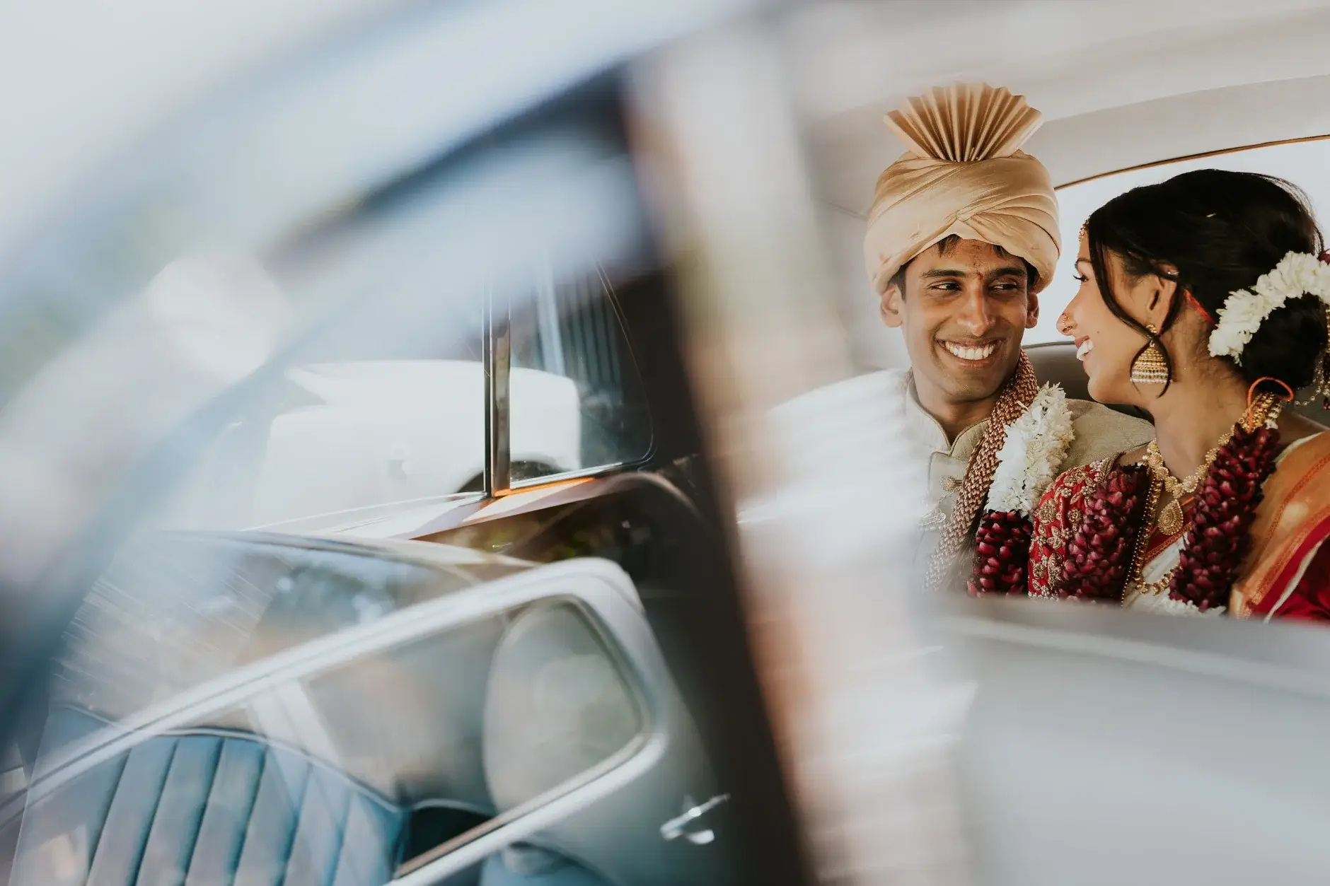 Brahman and Priyanka reflected in the car window after the ceremony
