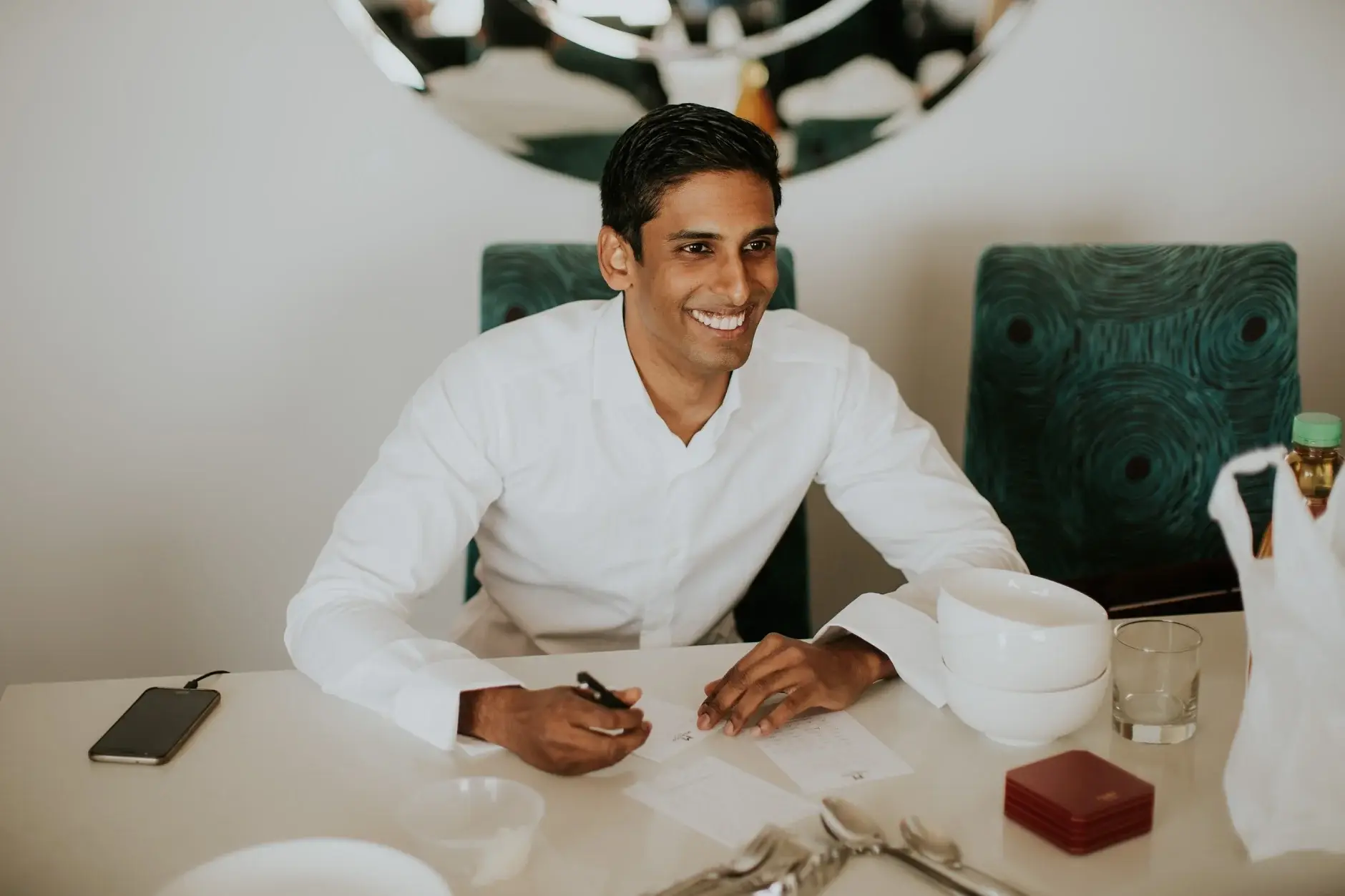 Brahman writing his vows at the hotel table, Sydney