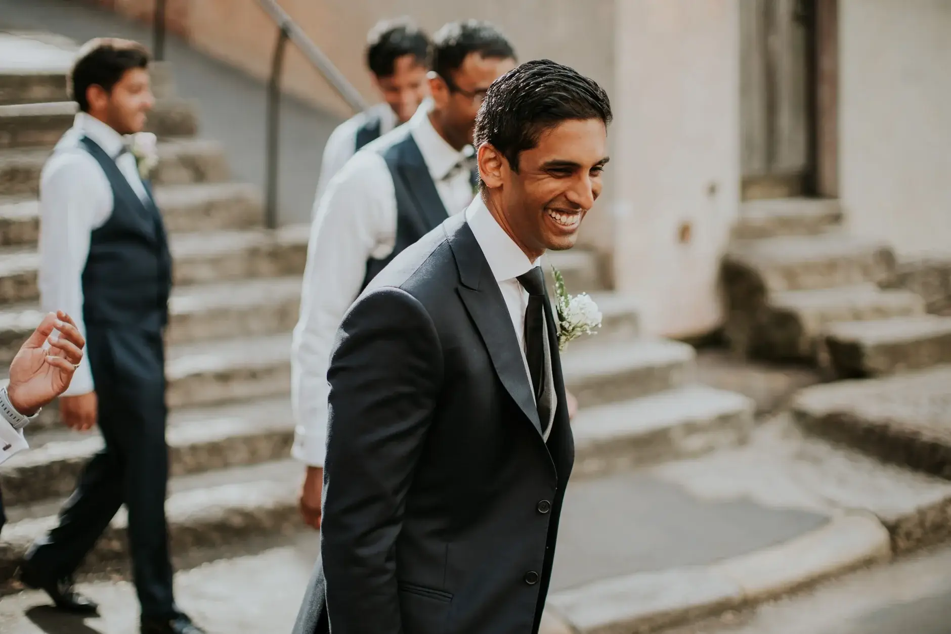 Brahman laughing with the groomsmen on the steps, Sydney