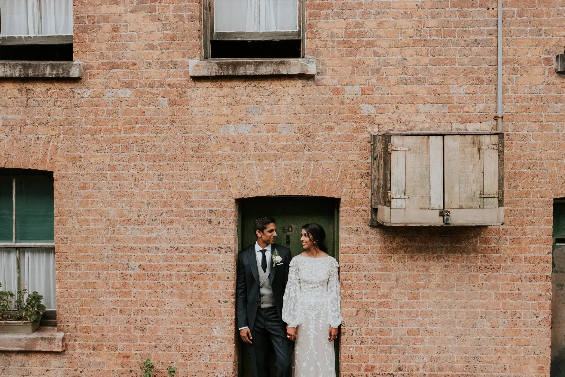 The two of them in a brick doorway, three frames, The Rocks