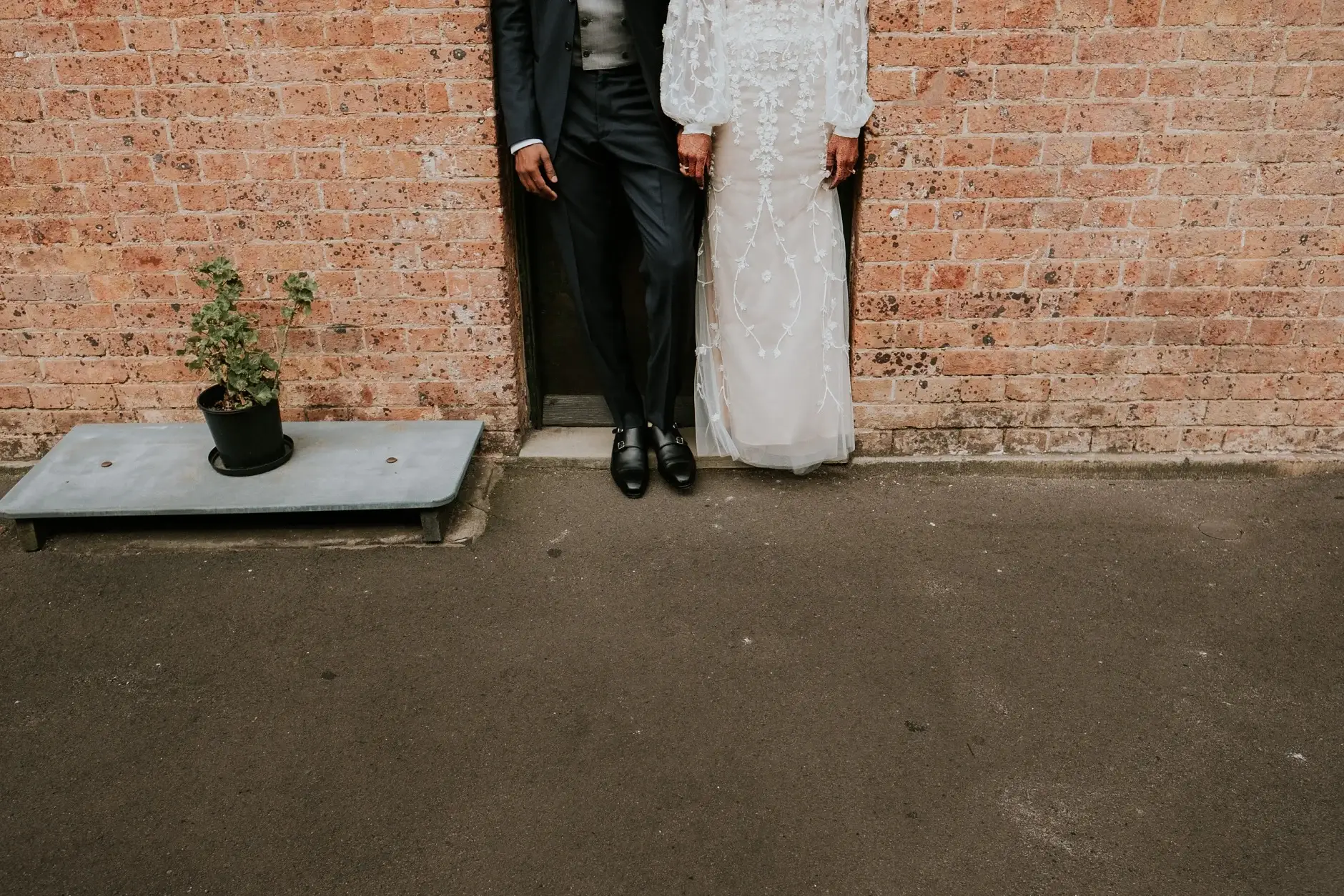 Brahman and Priyanka against the brick wall, Sydney