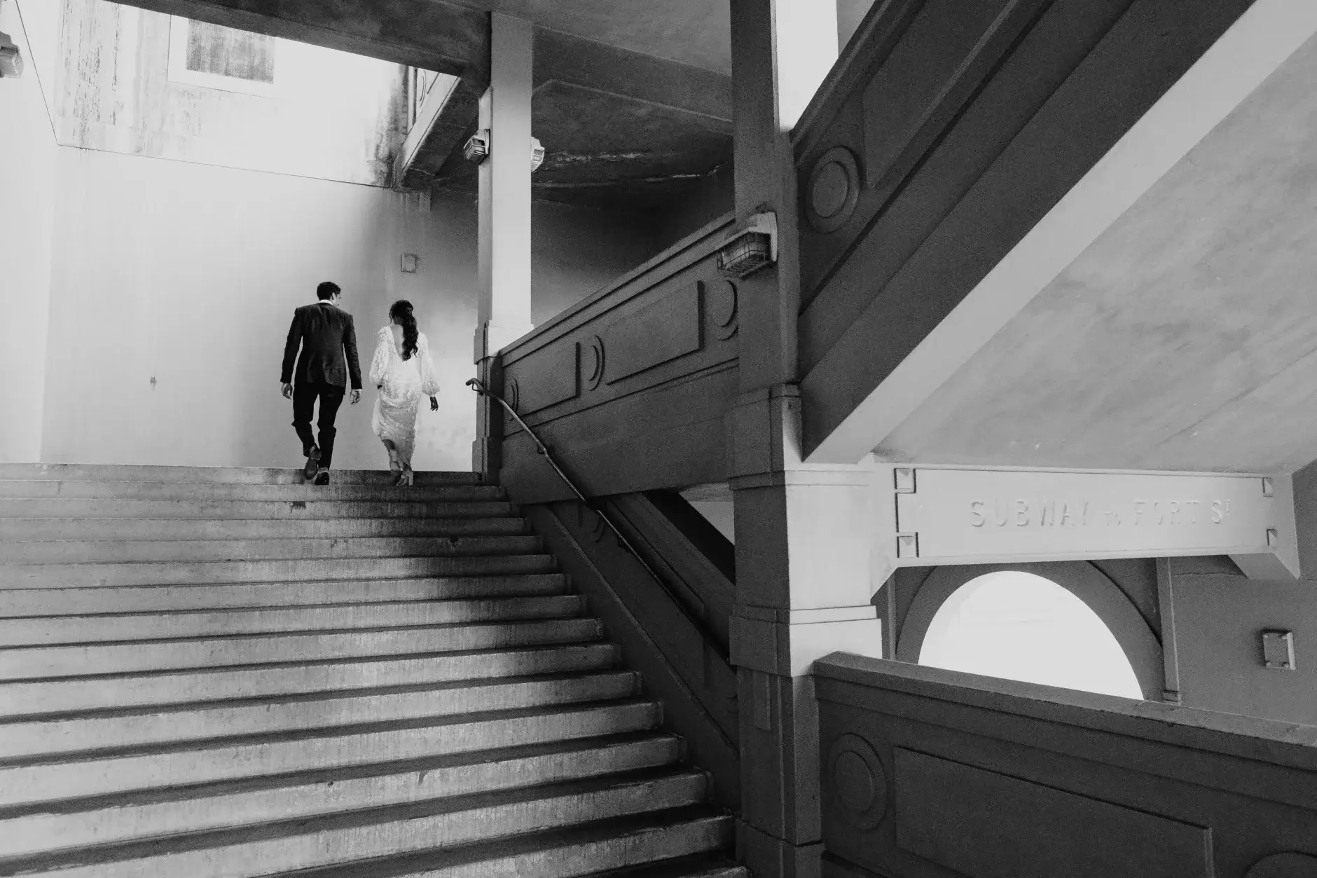Walking the stairs beneath the arches, black and white, Sydney