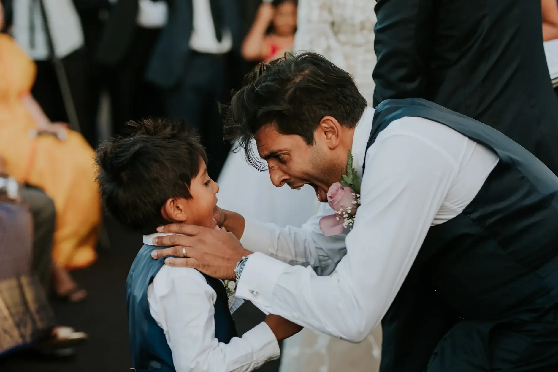 A boy being greeted by a groomsman, two frames, Sydney