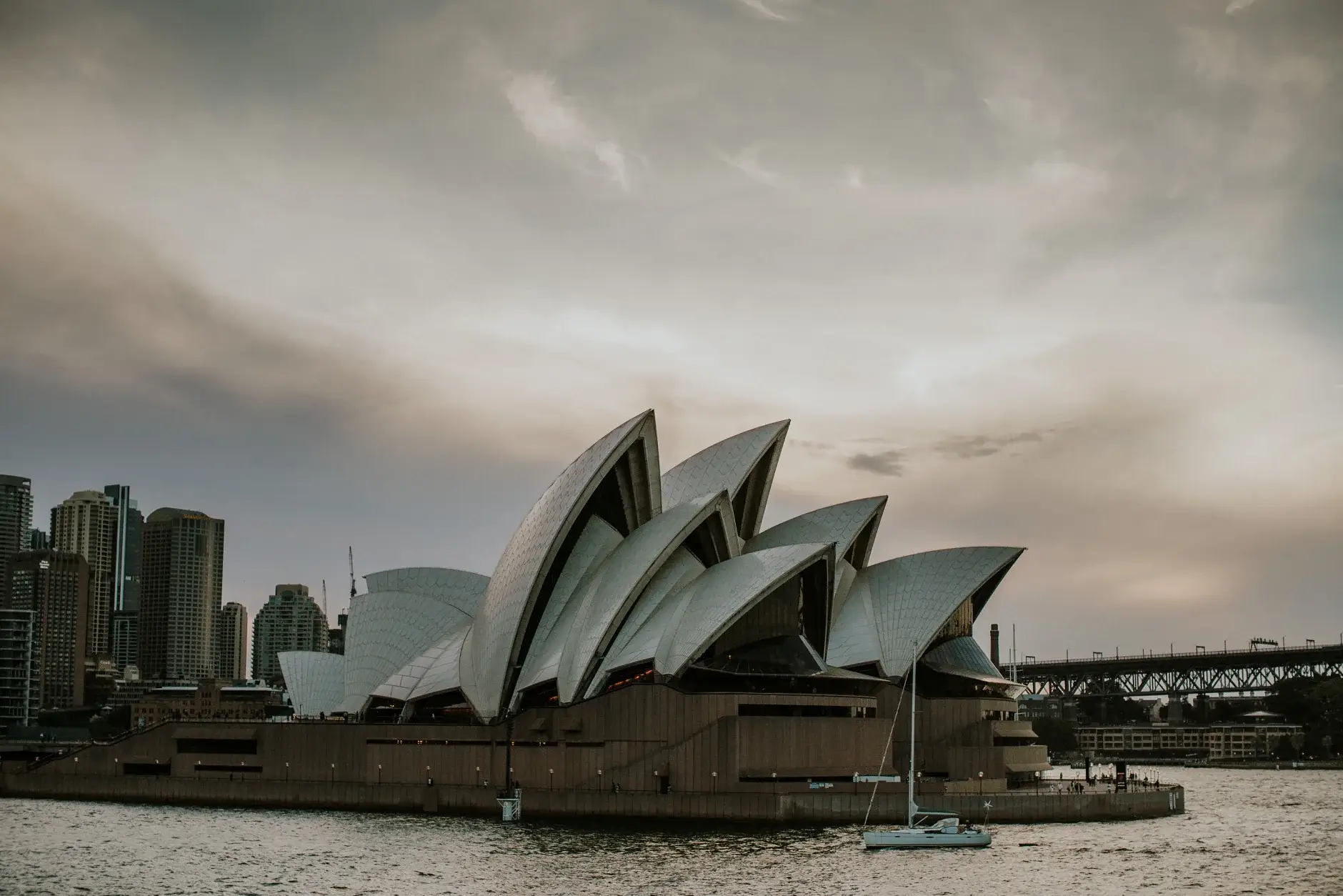 The Sydney Opera House under a heavy sky