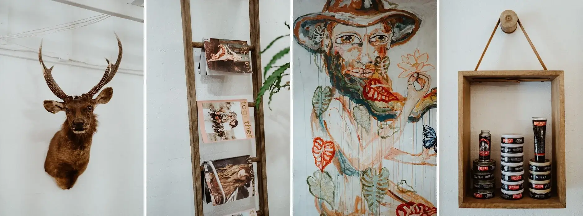 Details around the barber shop — a mounted stag head, a ladder of magazines and hanging clippers, Byron Bay