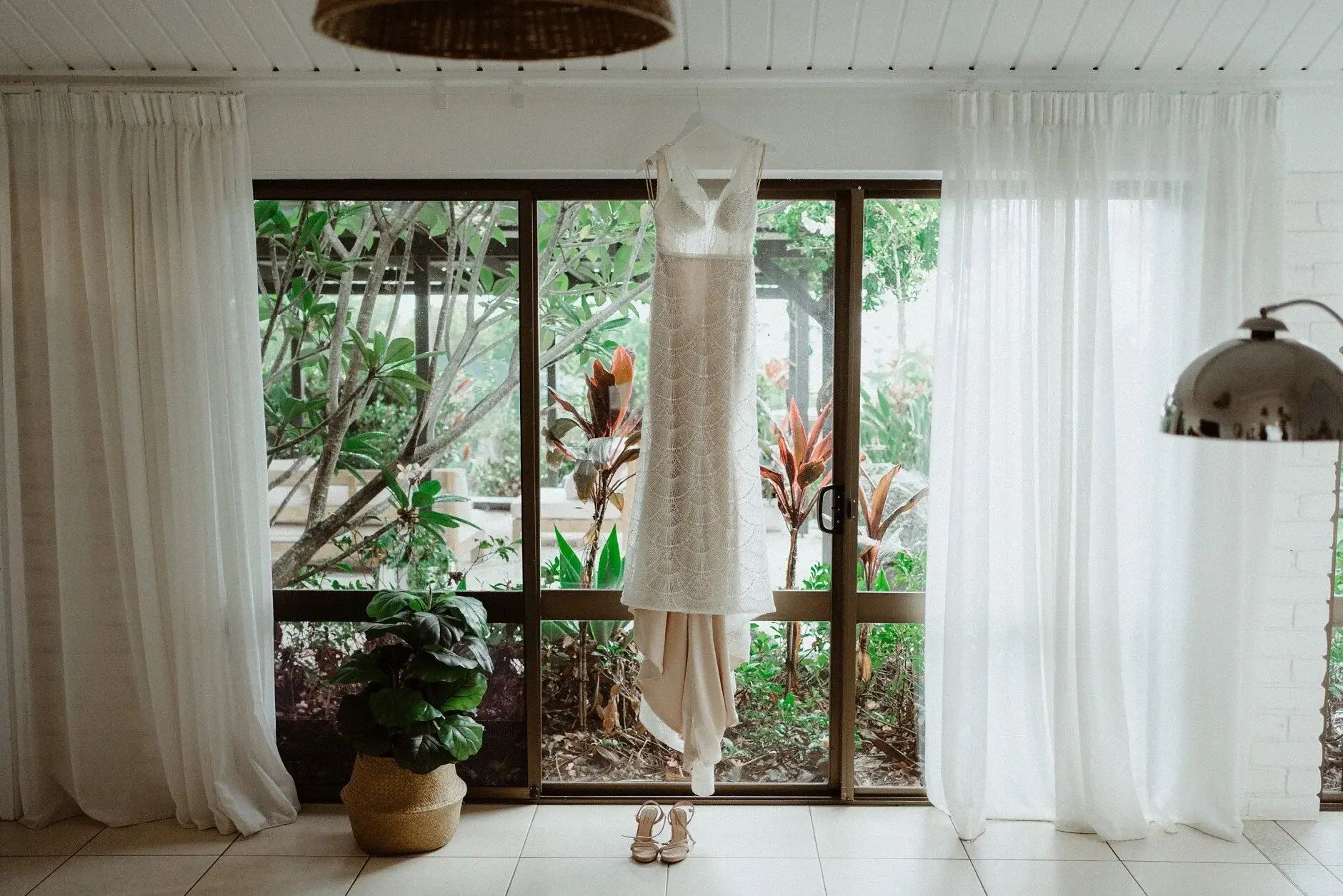 The bridal suite window with sheer curtains and a hanging chair, Byron View Farm