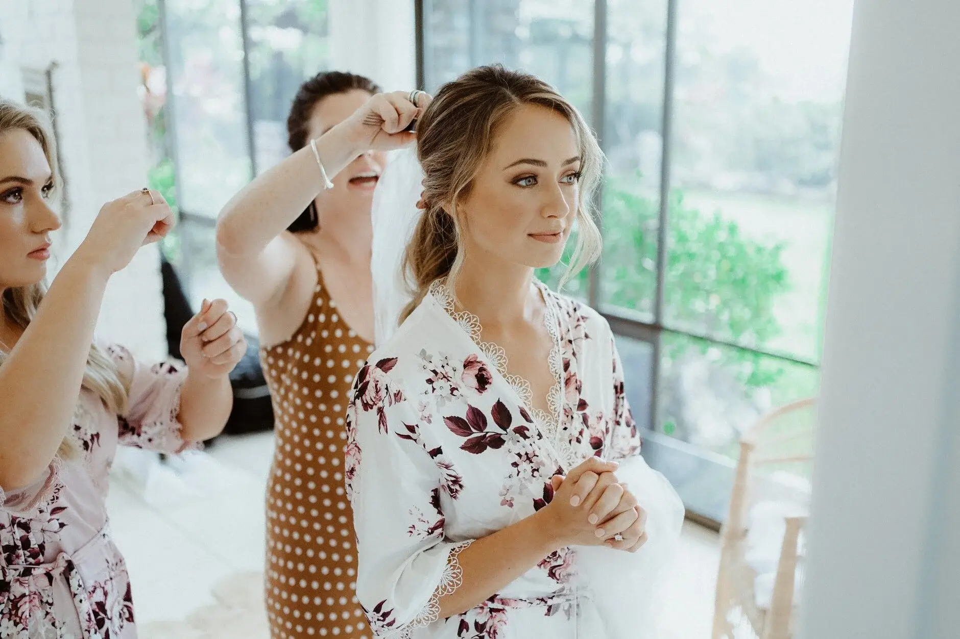 Breanna and her bridesmaids sharing a drink during hair and make-up, Byron Bay