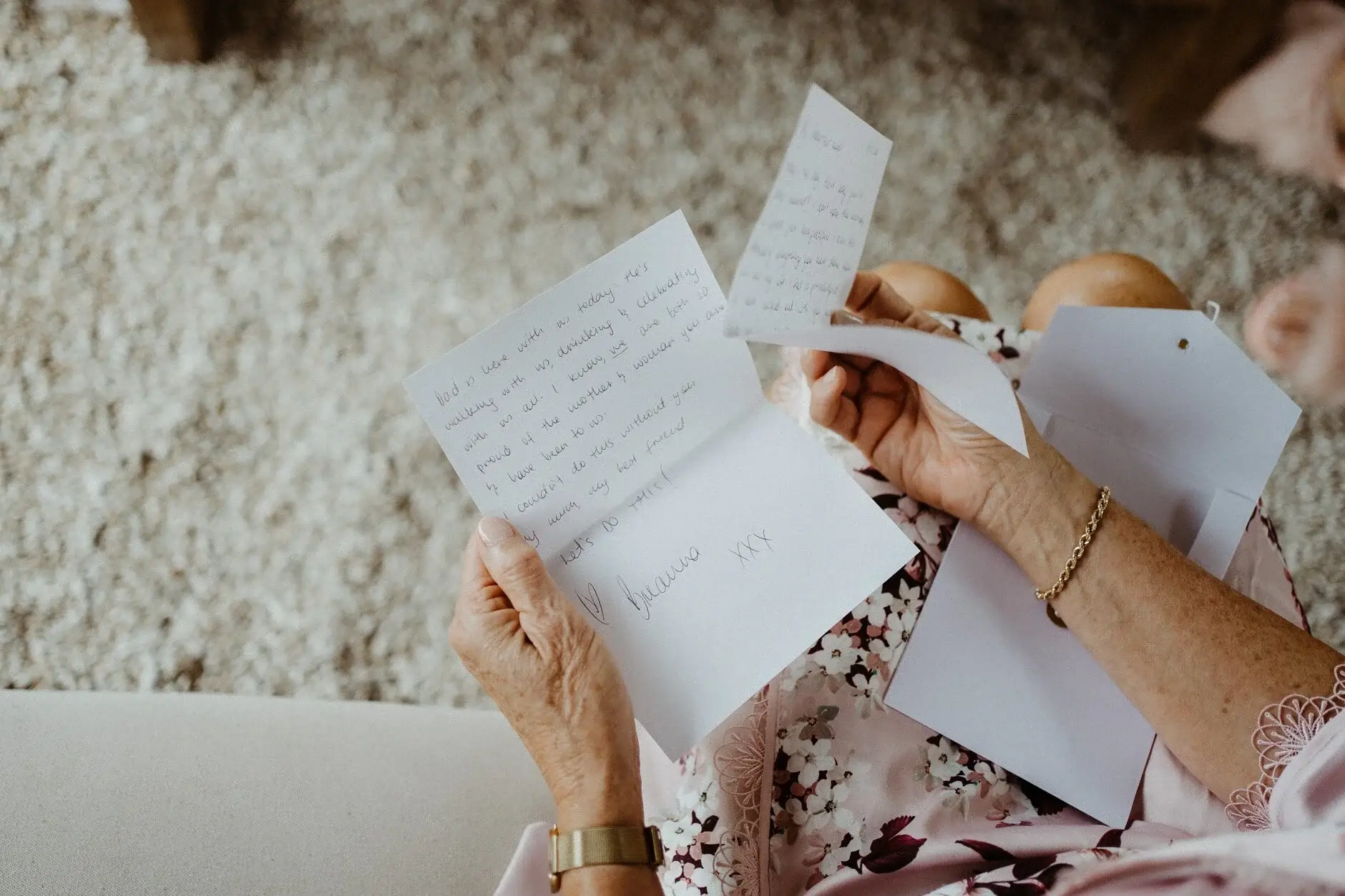 Breanna reading a handwritten card from Matt, Byron Bay