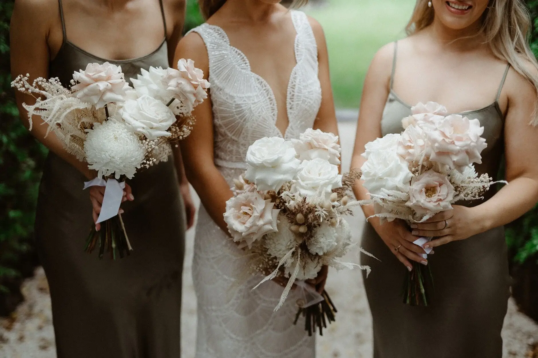 Breanna and her bridesmaids side by side with their Wilderness Flowers bouquets, Byron Bay