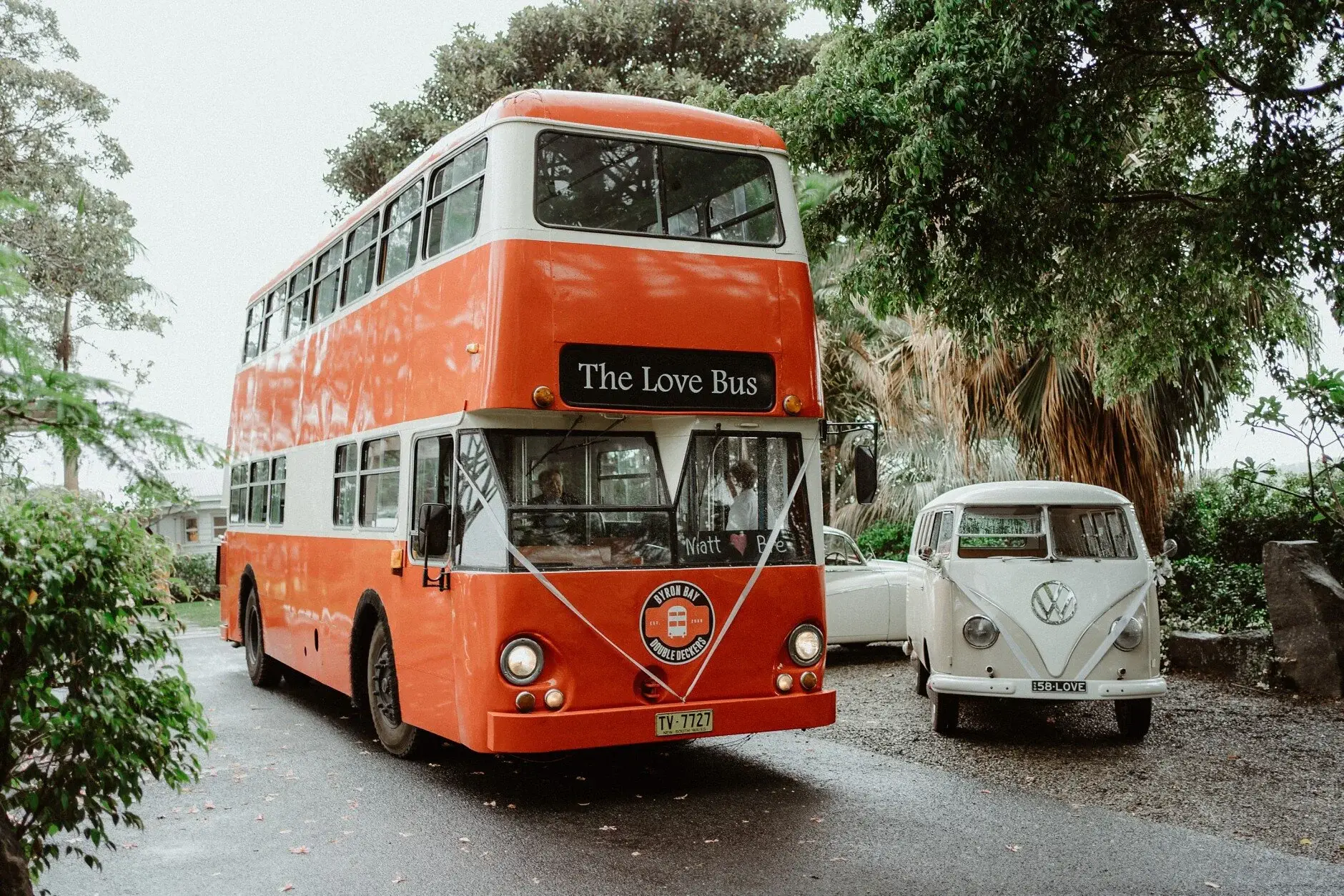 The red double-decker bus that carried guests, parked in the rain, Byron Bay
