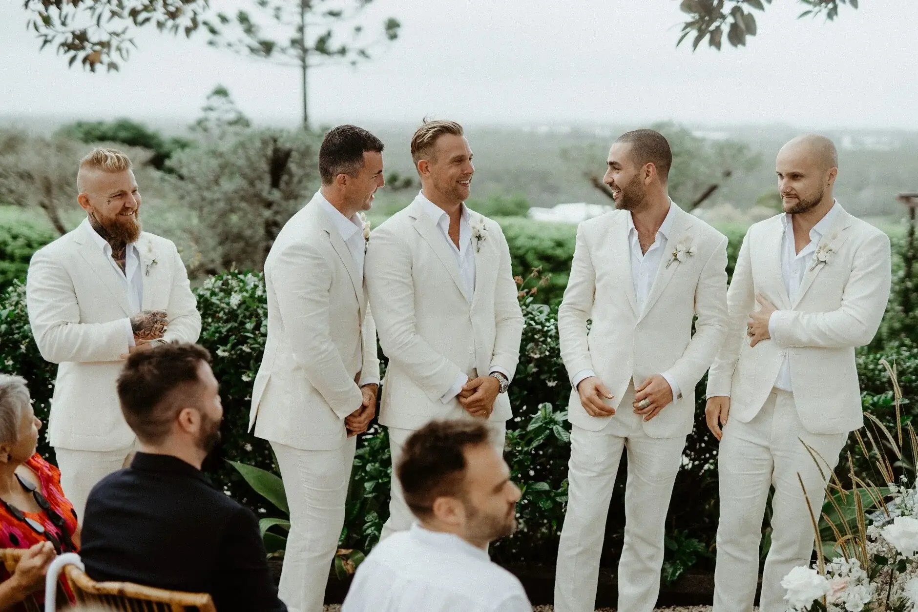 Matt and the groomsmen waiting among the seated guests, The Fig Tree Byron Bay