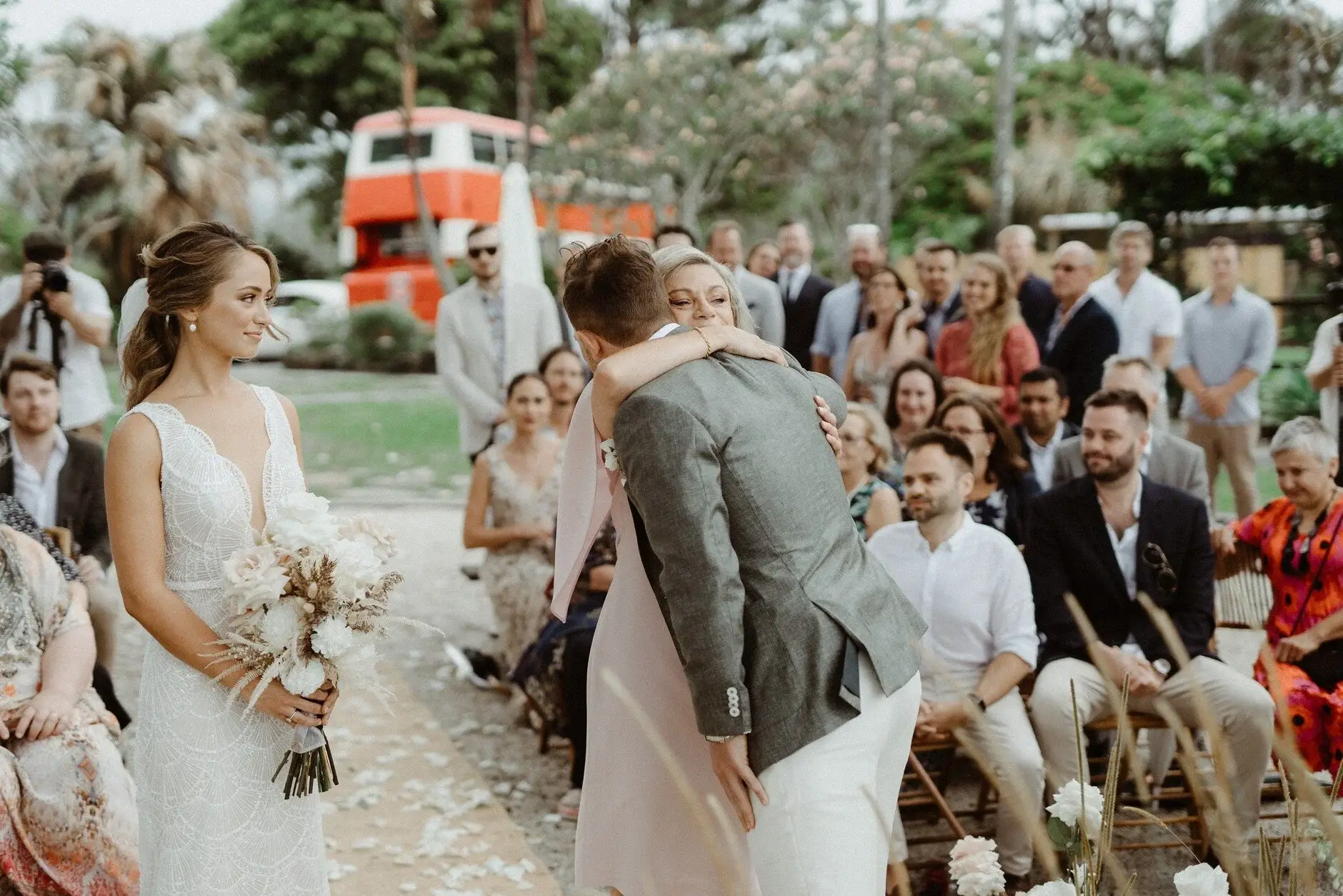 Breanna being greeted at the aisle by family, The Fig Tree Byron Bay