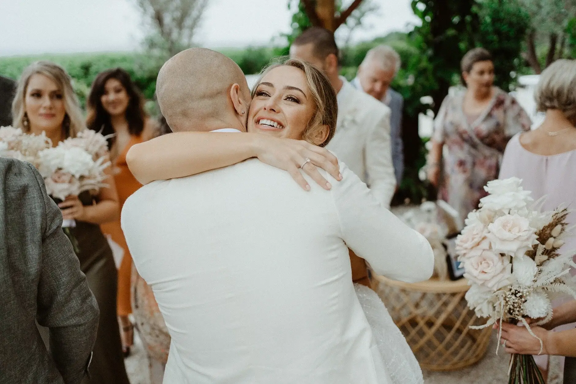 Breanna embracing a family member after the ceremony, The Fig Tree Byron Bay