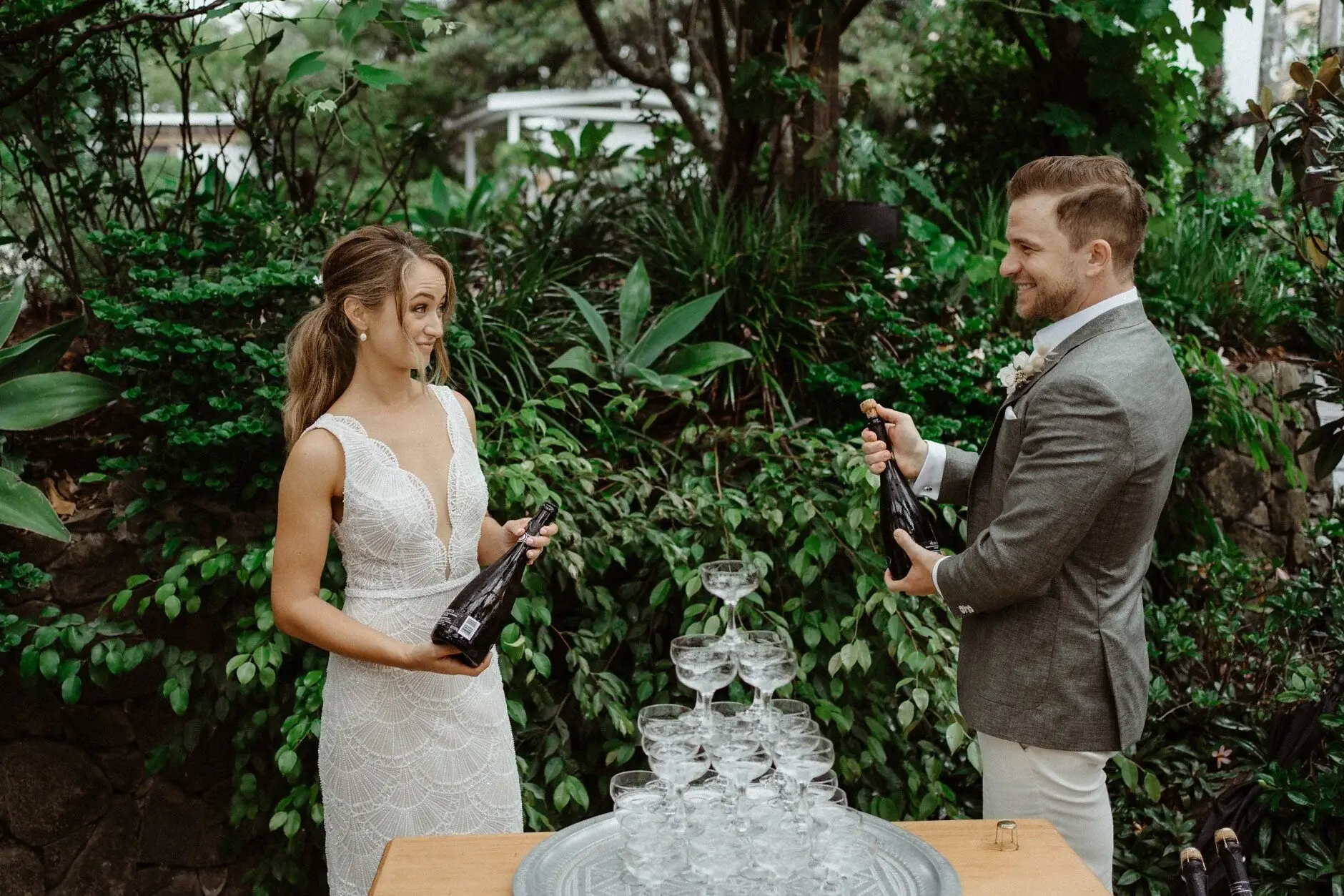 Breanna and Matt beside the champagne tower before the toast, The Fig Tree Byron Bay