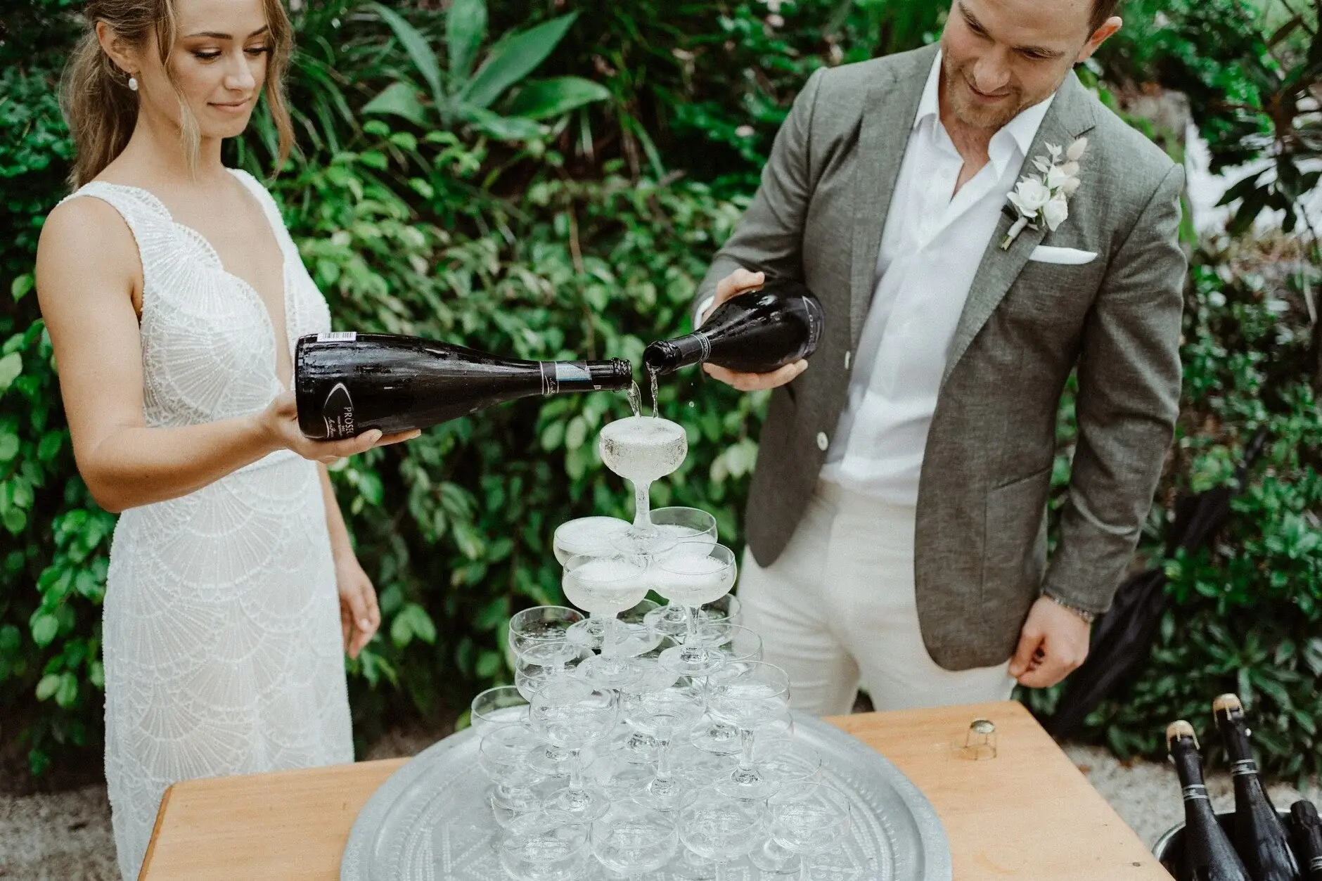 Breanna tipping the bottle over the champagne tower, The Fig Tree Byron Bay