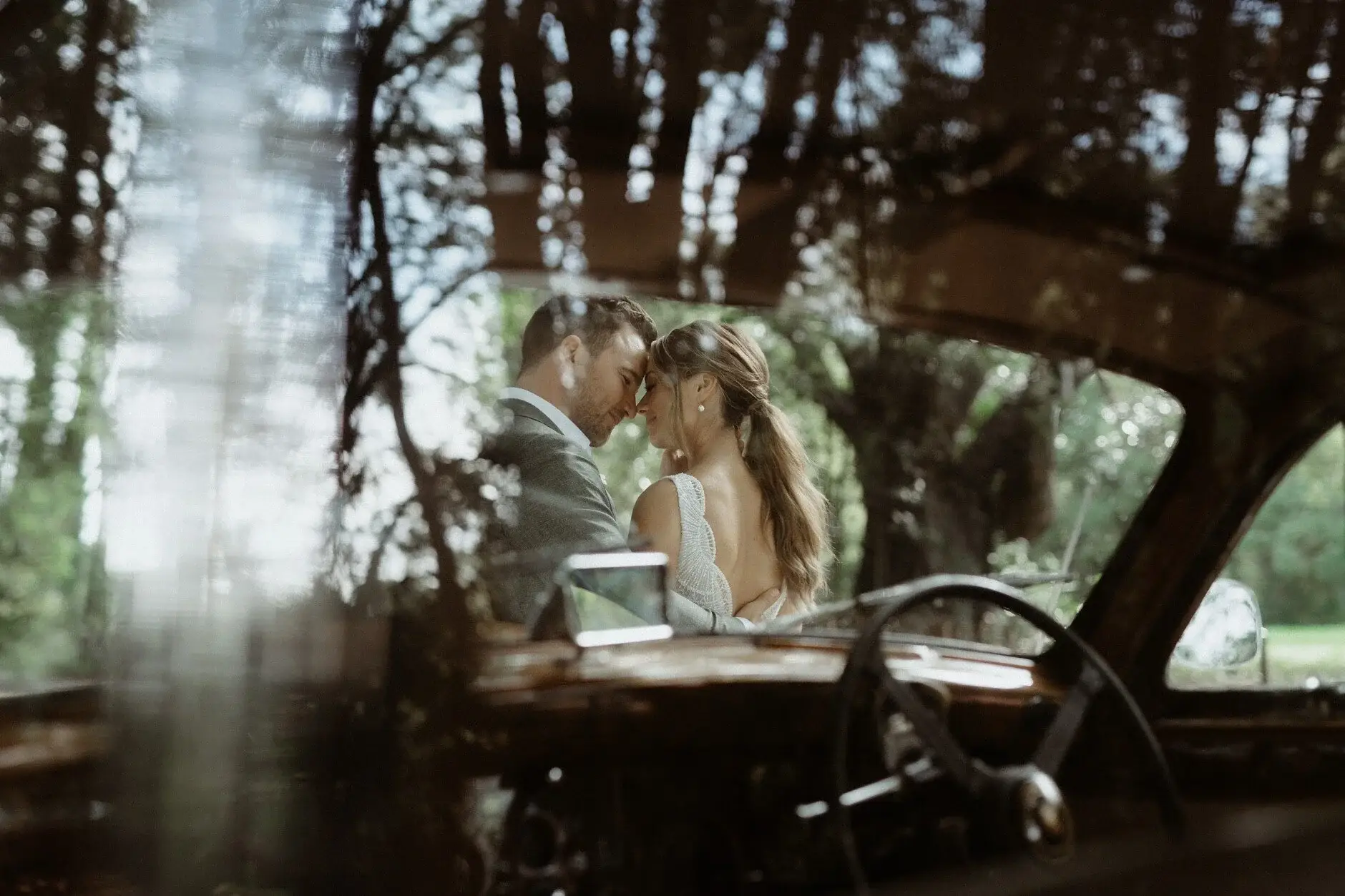 The couple seen through the car window, Byron Bay