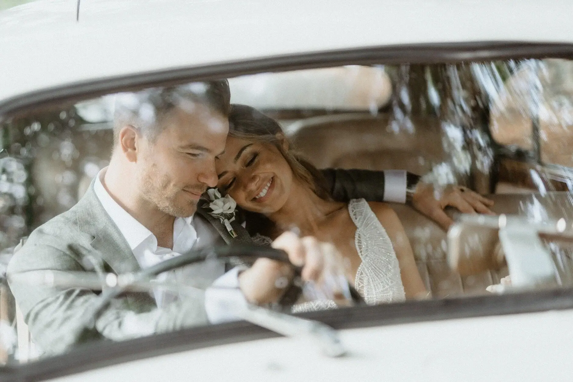 Breanna and Matt close together in the back of the car, Byron Bay