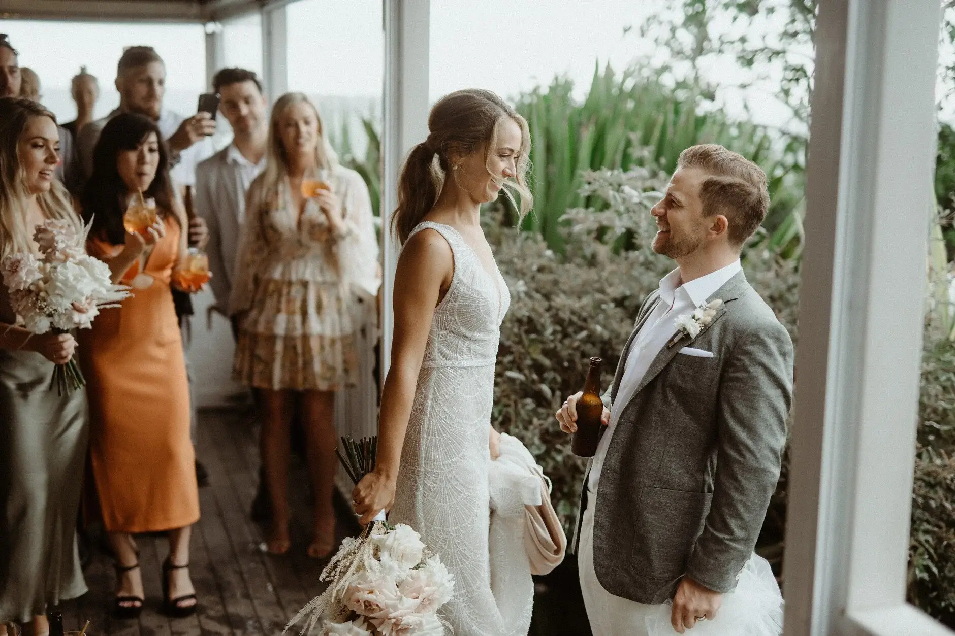 Breanna and Matt greeting guests on the verandah, Byron View Farm