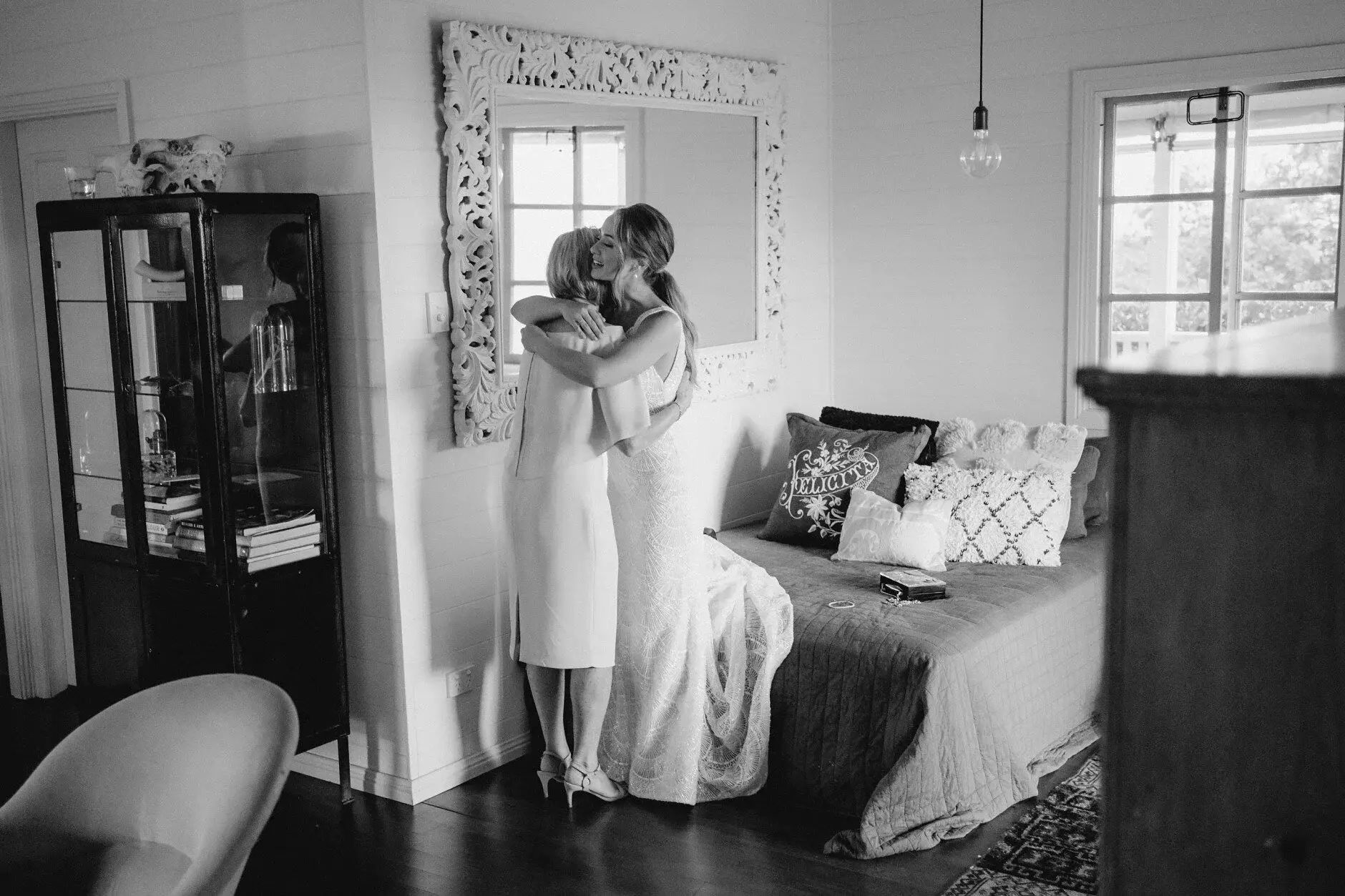 Breanna at the window of the farmhouse bedroom, black and white, Byron View Farm