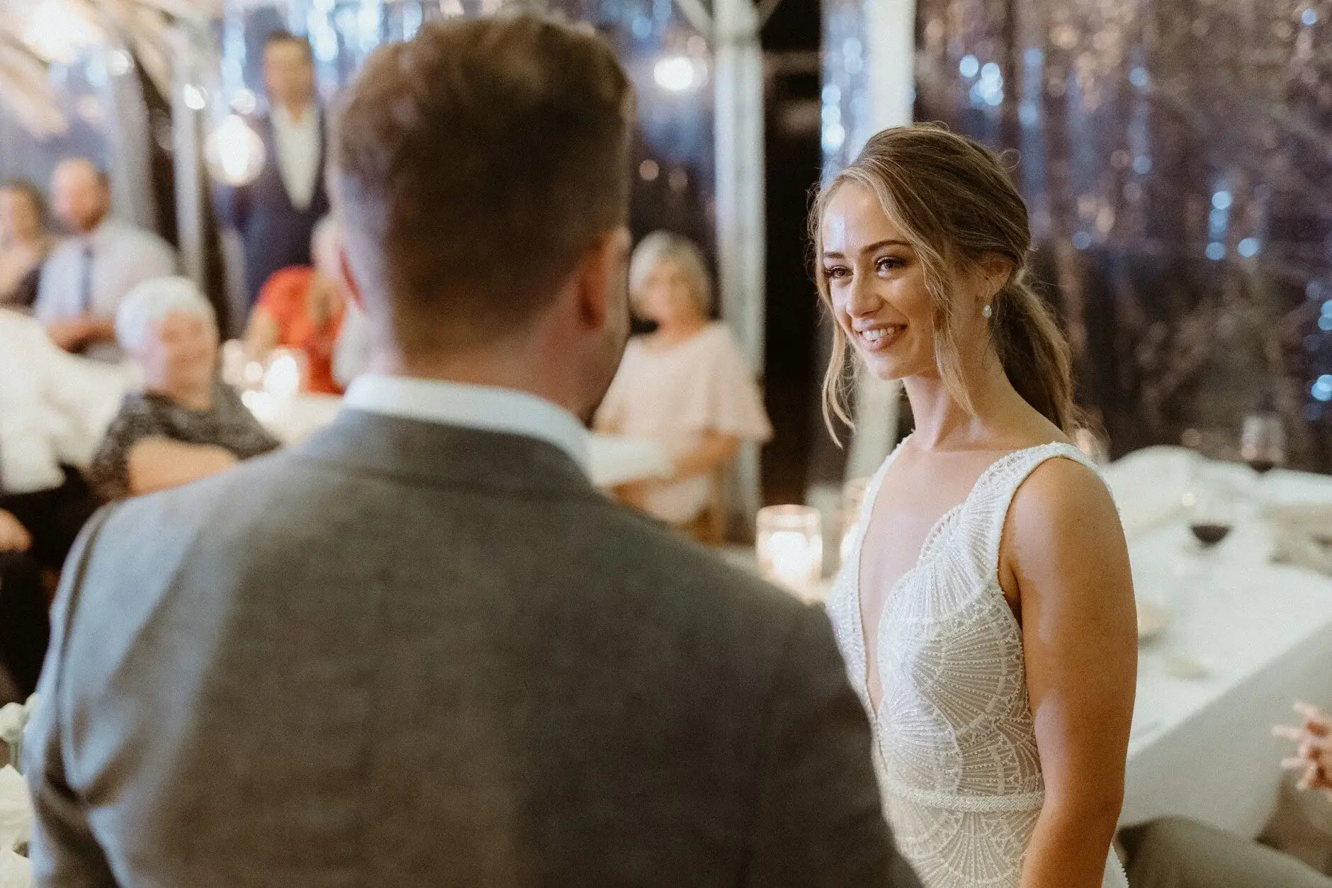 Breanna and Matt facing each other during the speeches, Byron View Farm
