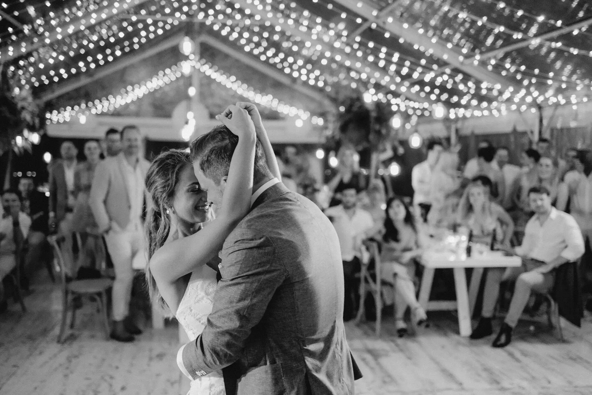 Breanna and Matt dancing as guests watch, Byron View Farm
