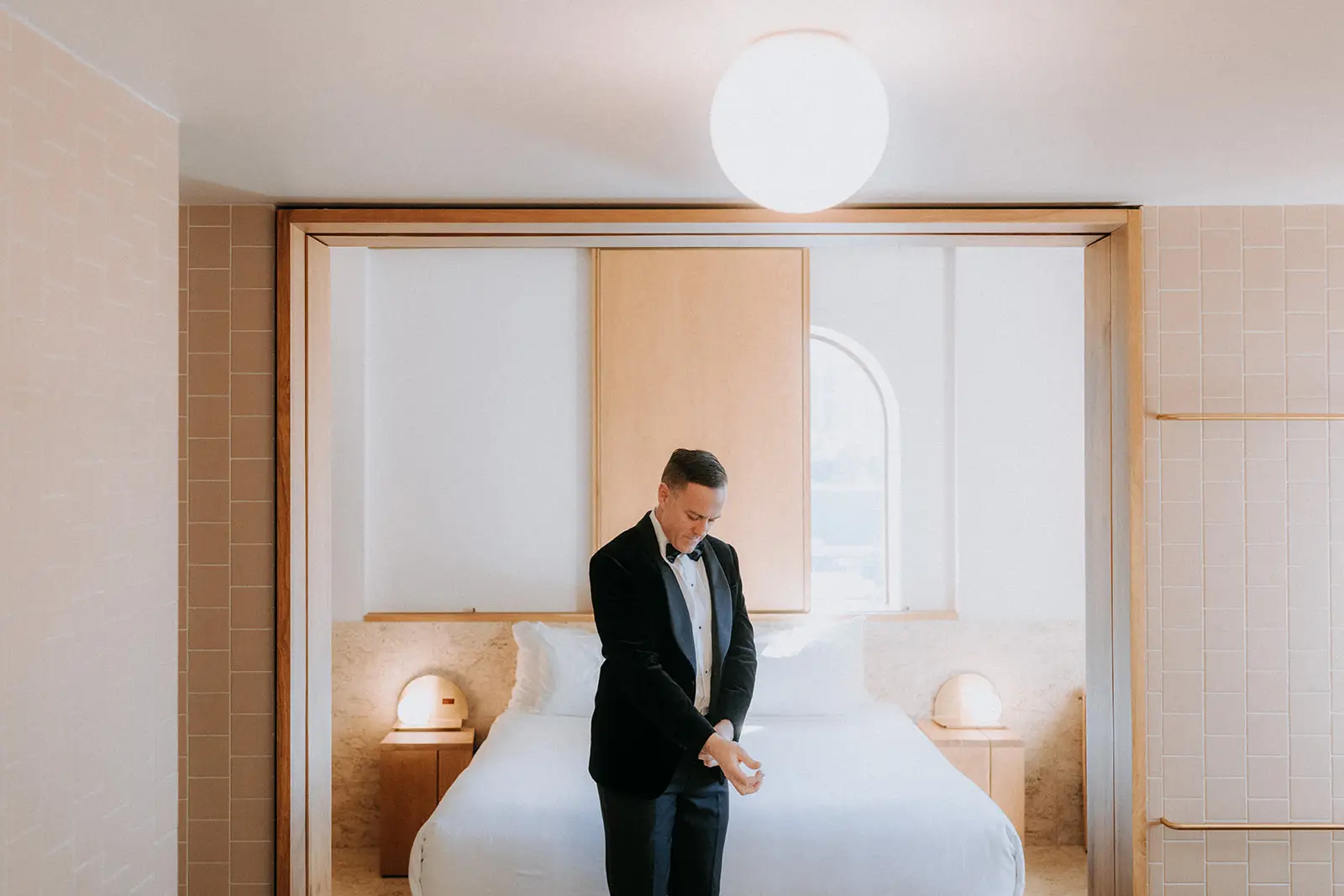 The groom dressed and waiting in his room, The Calile Hotel