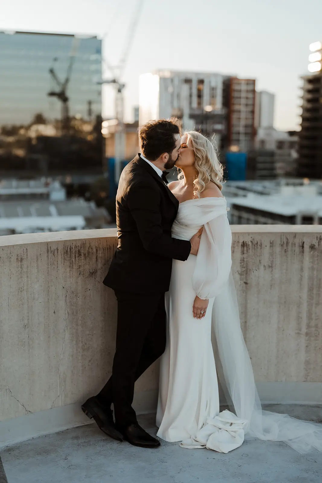 A couple on the roof with the Brisbane skyline behind, The Calile Hotel
