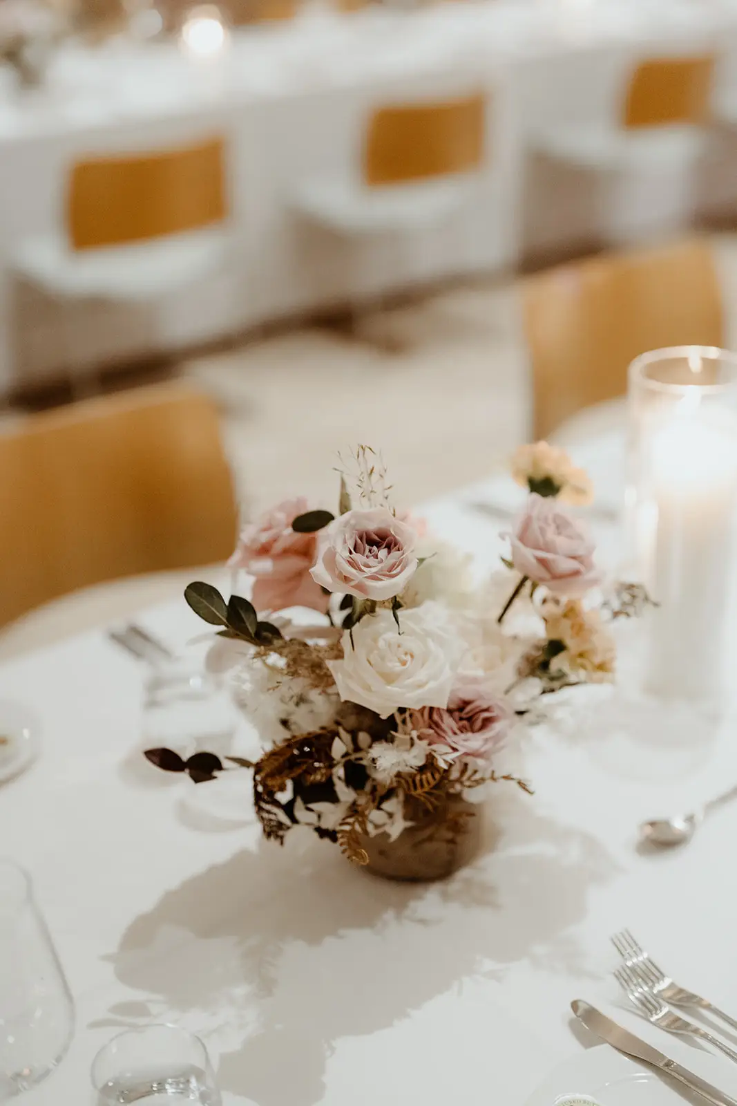 A low arrangement of pale roses on a reception table, The Calile Hotel