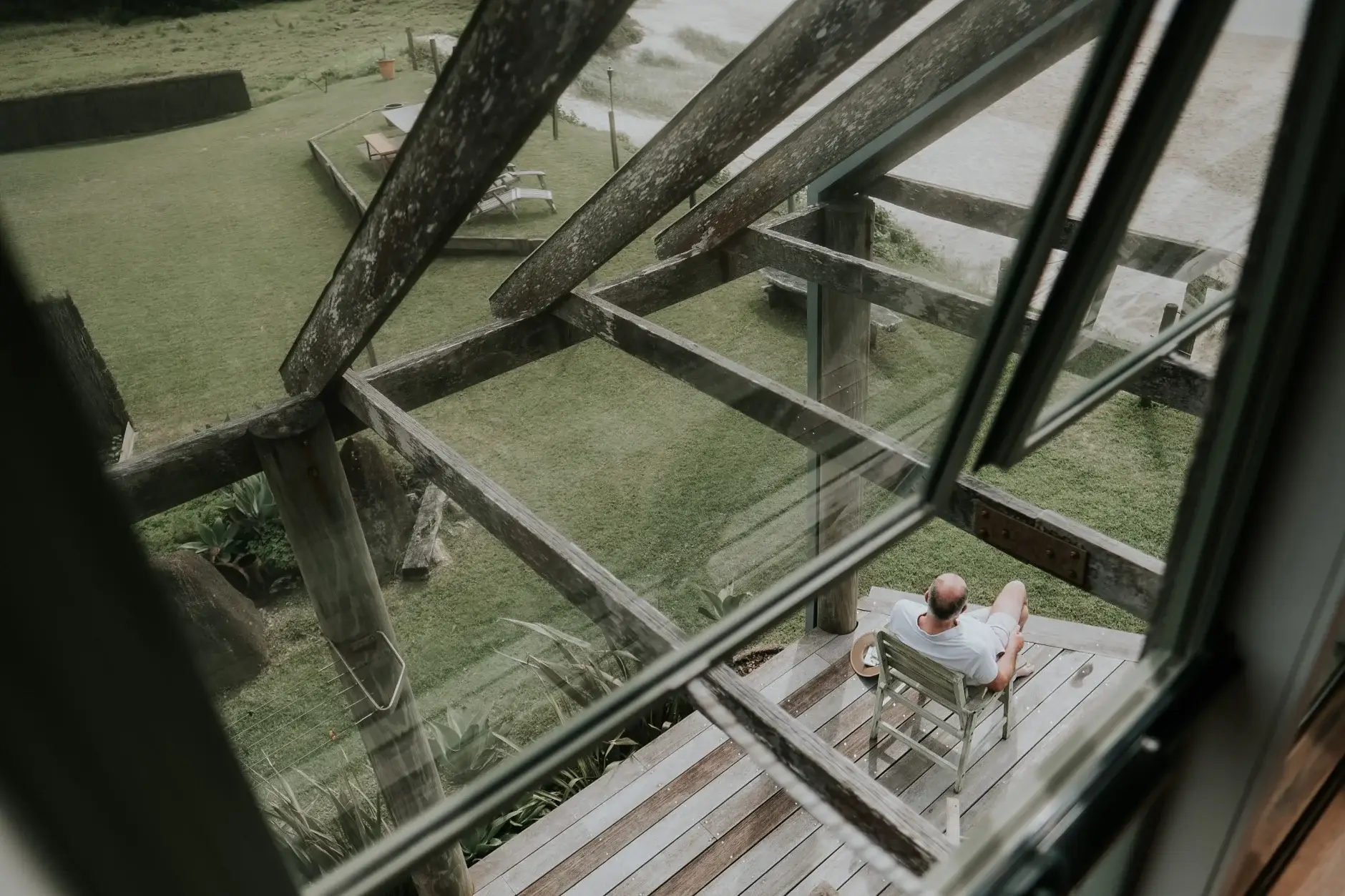 Looking down through the timber beams to the deck below, Belongil Beach
