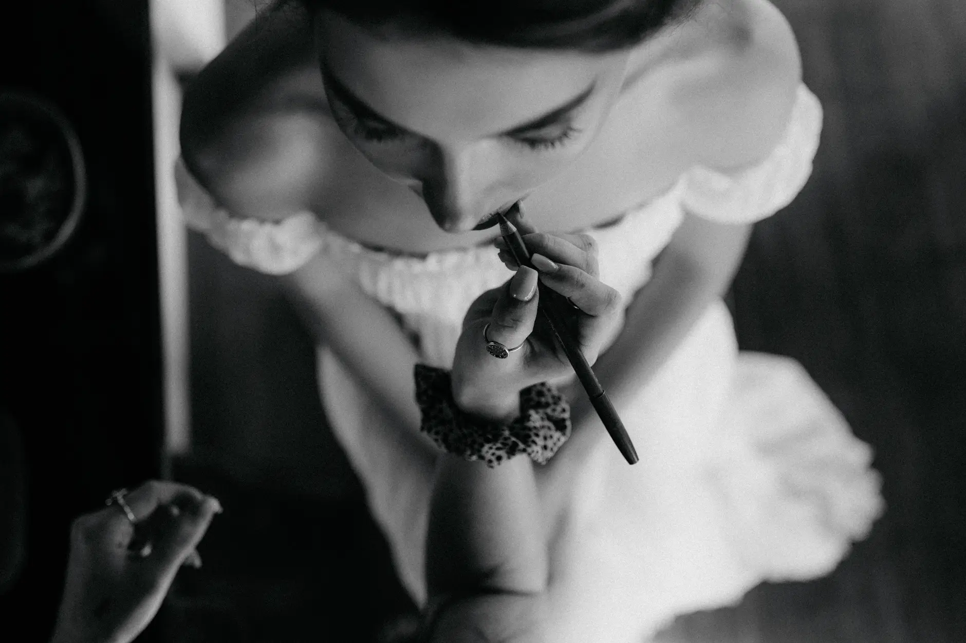 Cassie getting ready with a friend, and finishing her lipstick