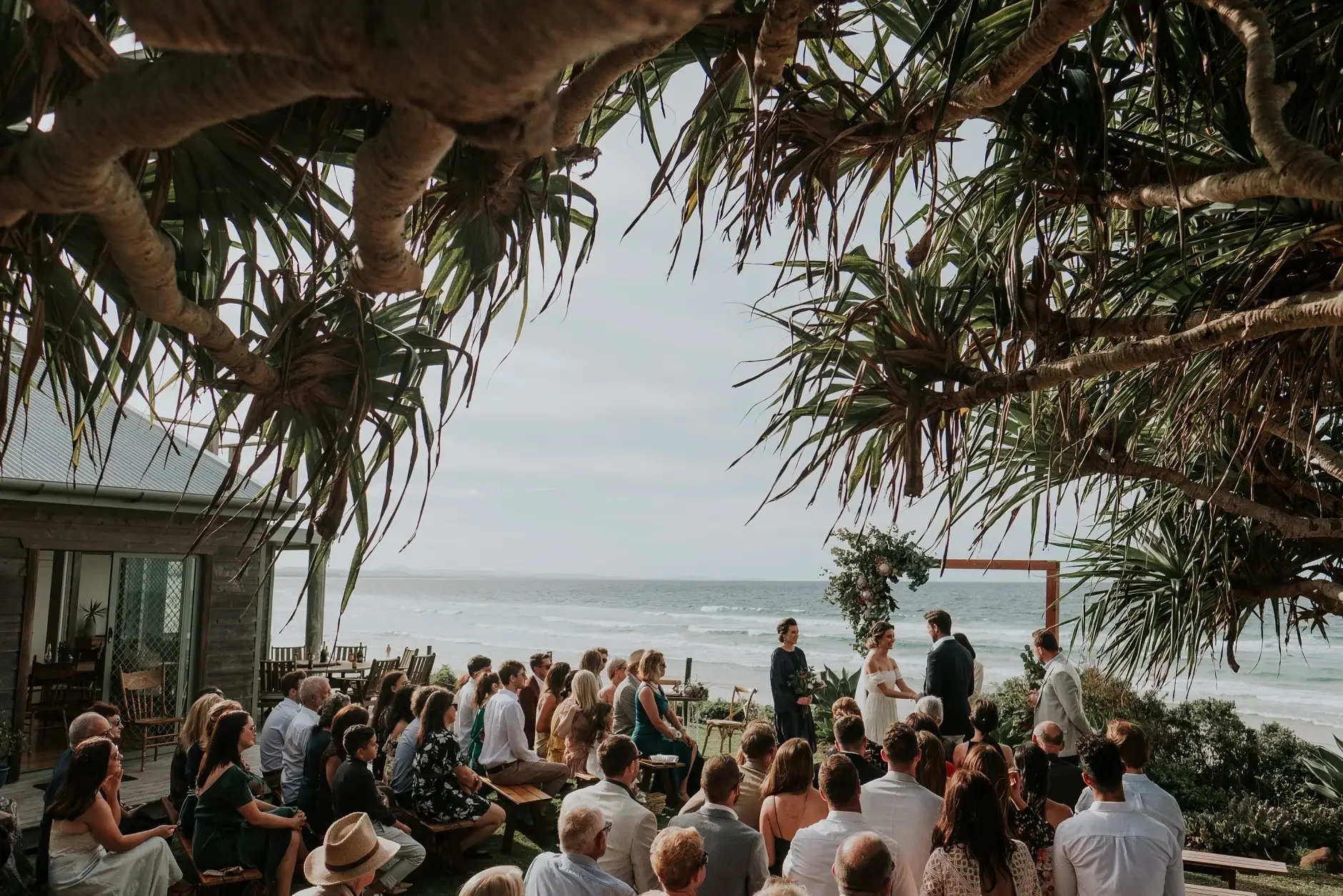 Rings held ready, and hands during the ceremony, Belongil Beach