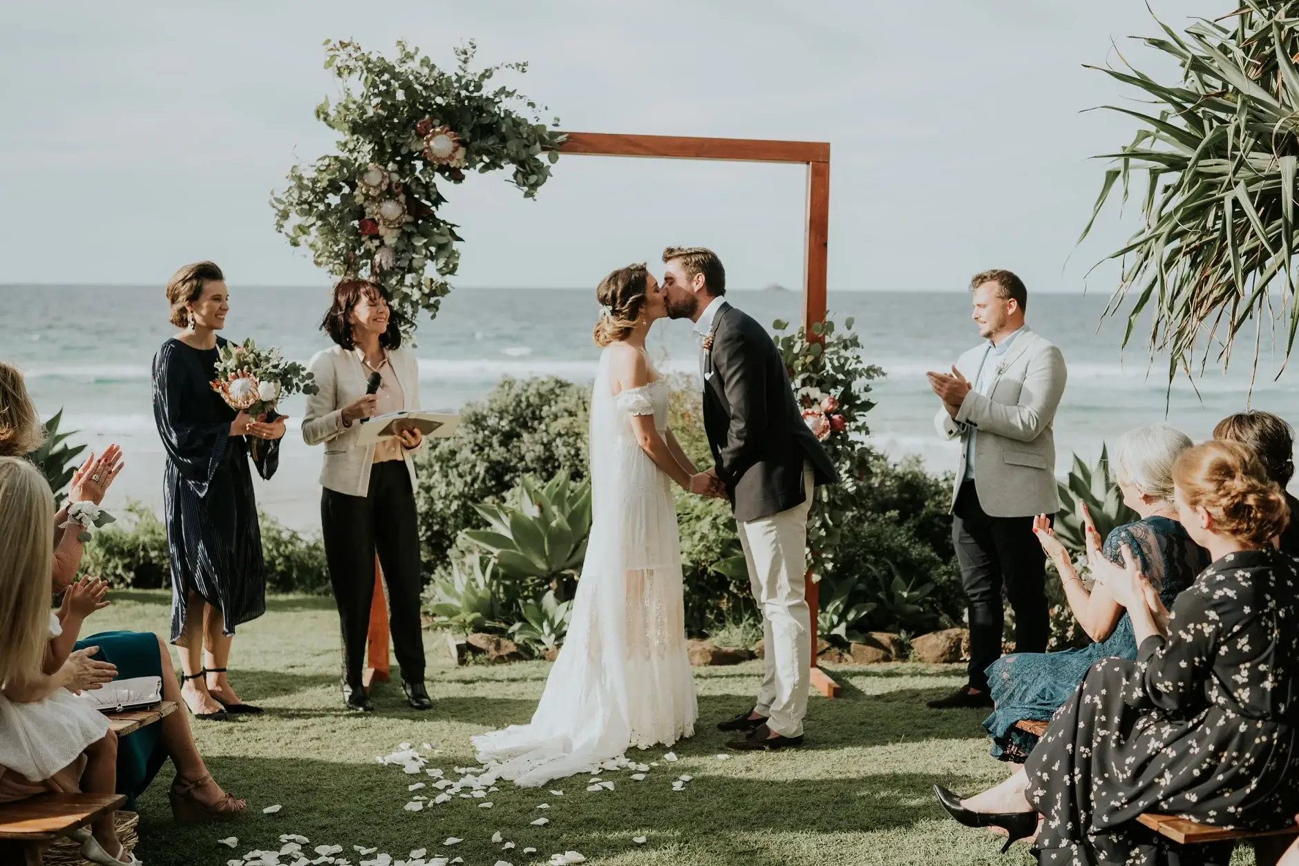 Signing the marriage certificate on the lawn, three frames, Belongil