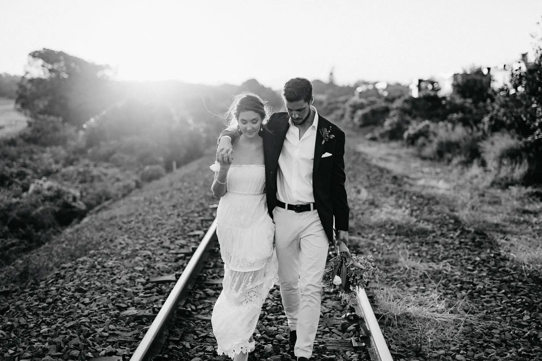 Cassie and Jack laughing on the railway line, Byron Bay