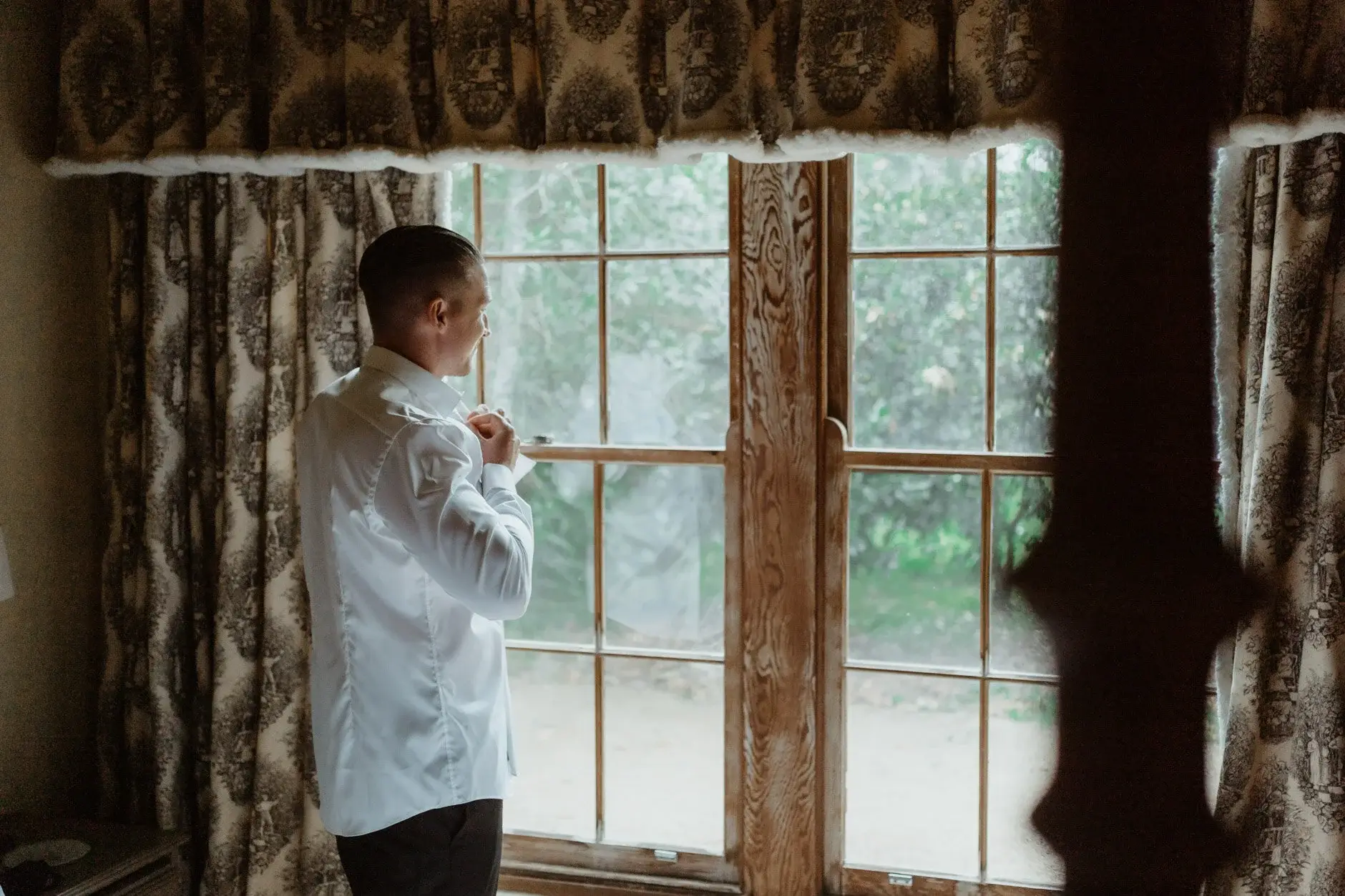 John dressing in the window light of the old farmhouse, Deux Belettes