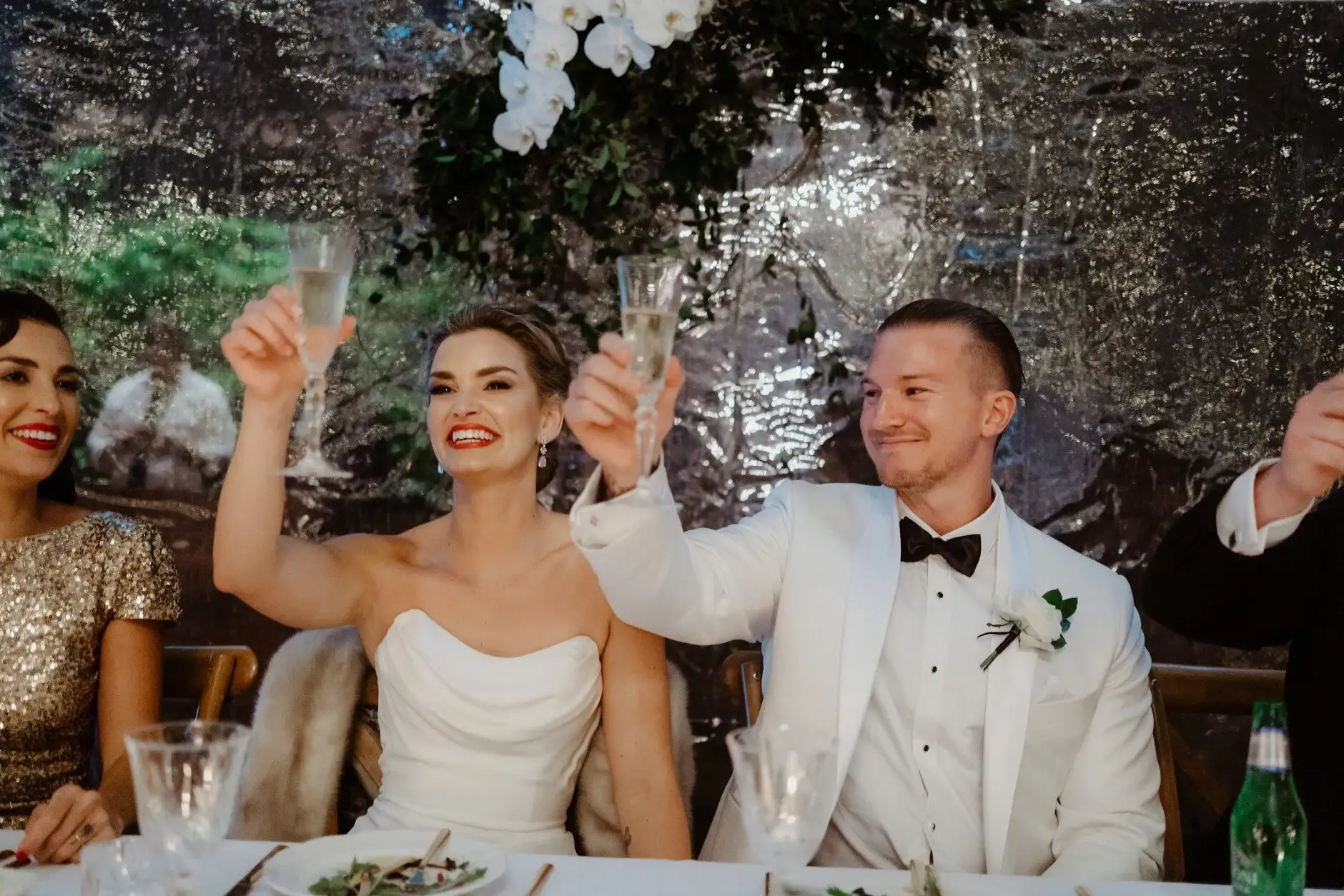 Maddie and John cheering at their table, Deux Belettes